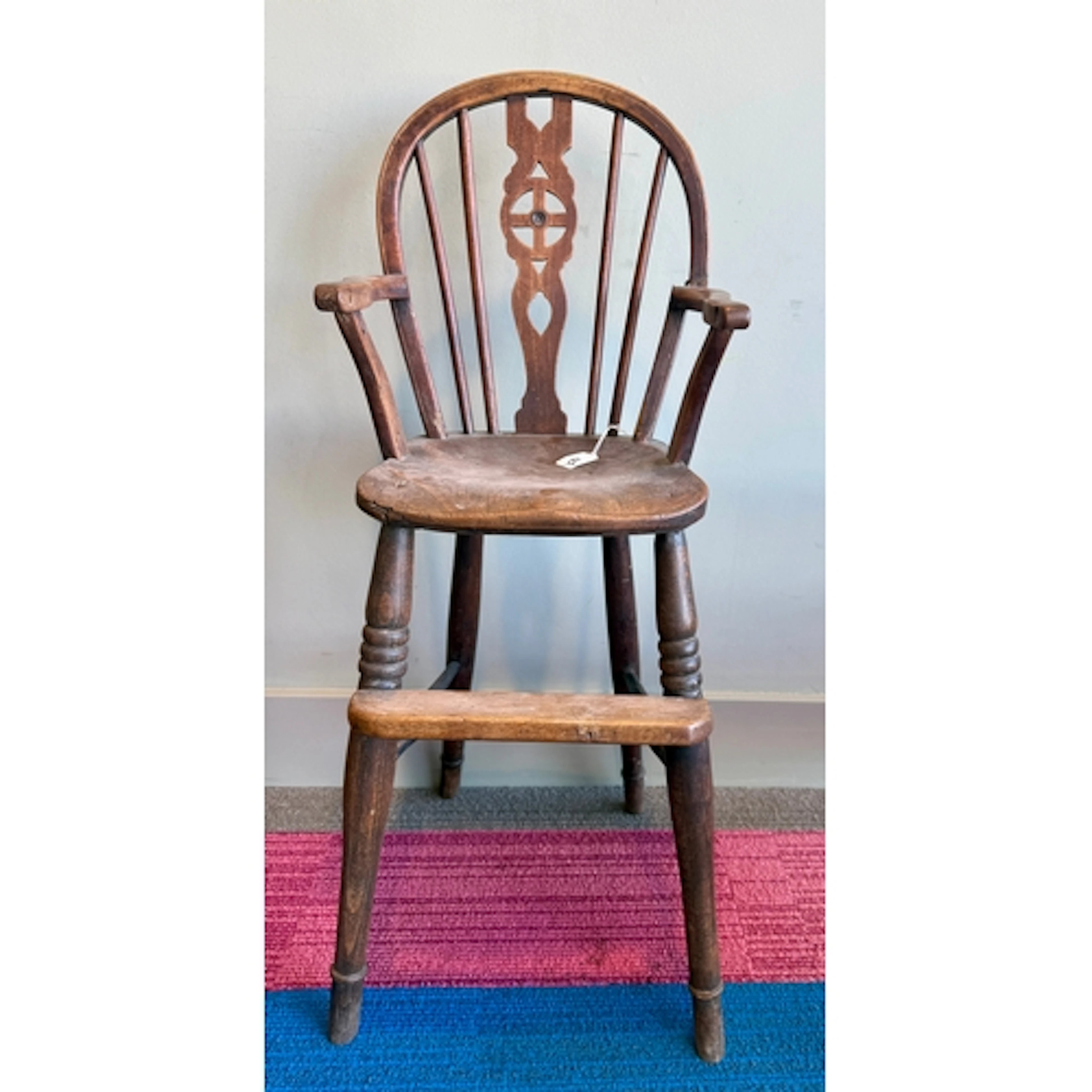A 19thC child's wheelback Windsor highchair. 89 h to back.
