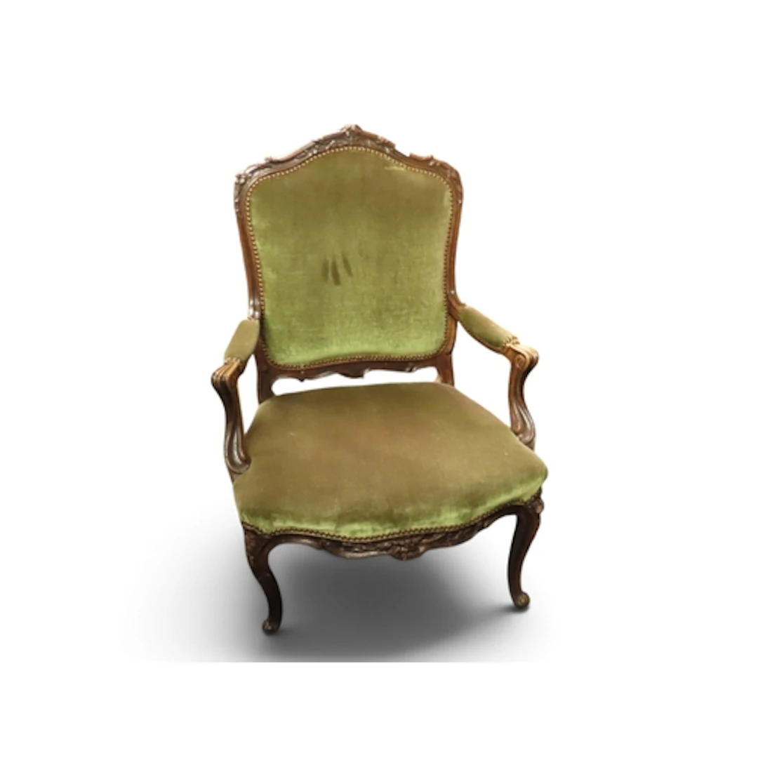 A 20th century Louis XVI style open armchair with green velo...