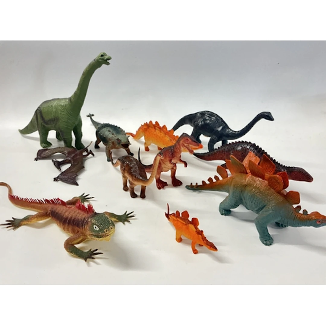 A Box Containing Plastic Animal Figures Including Dinosaurs,...