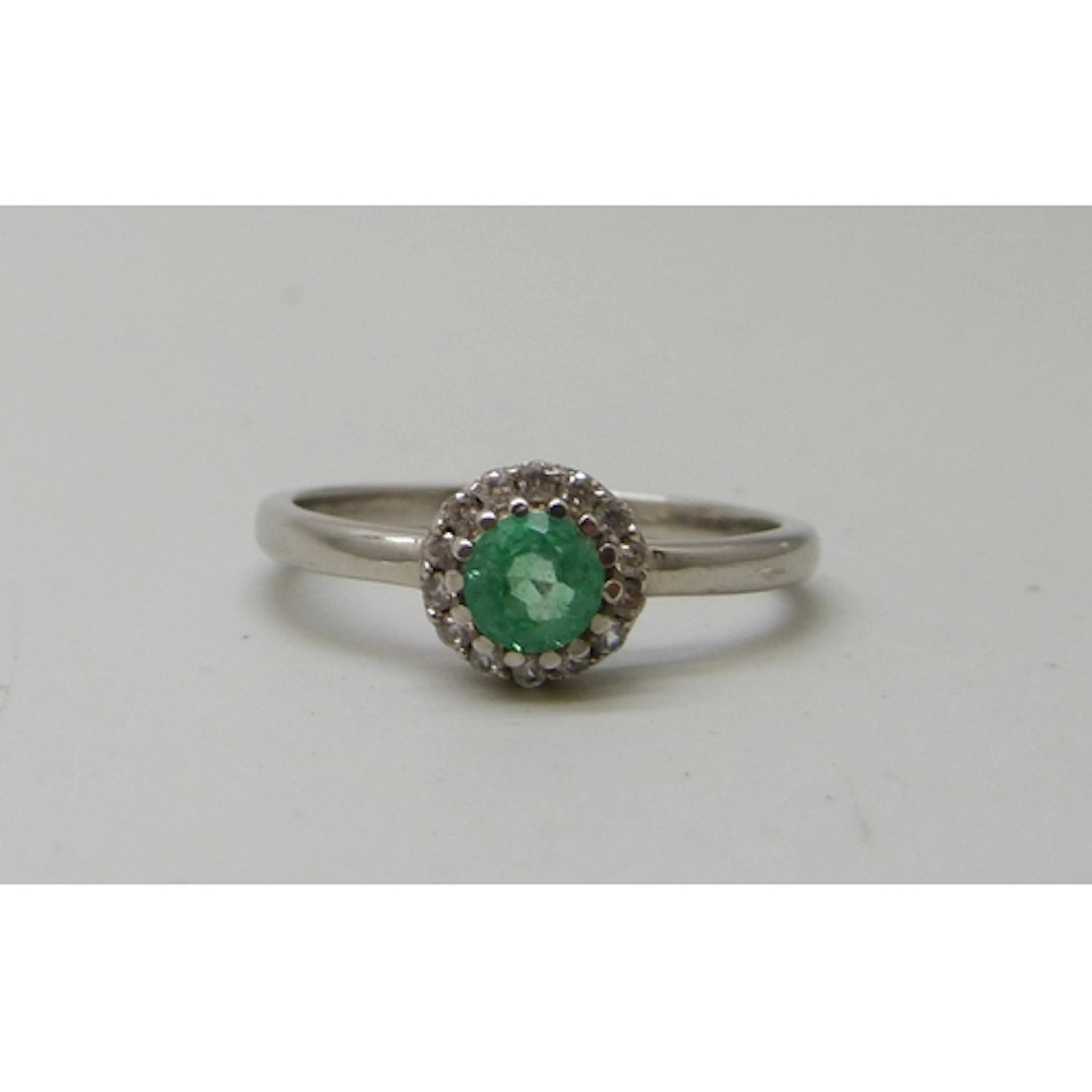 A Gemporia silver, emerald and white stone cluster ring, N/O