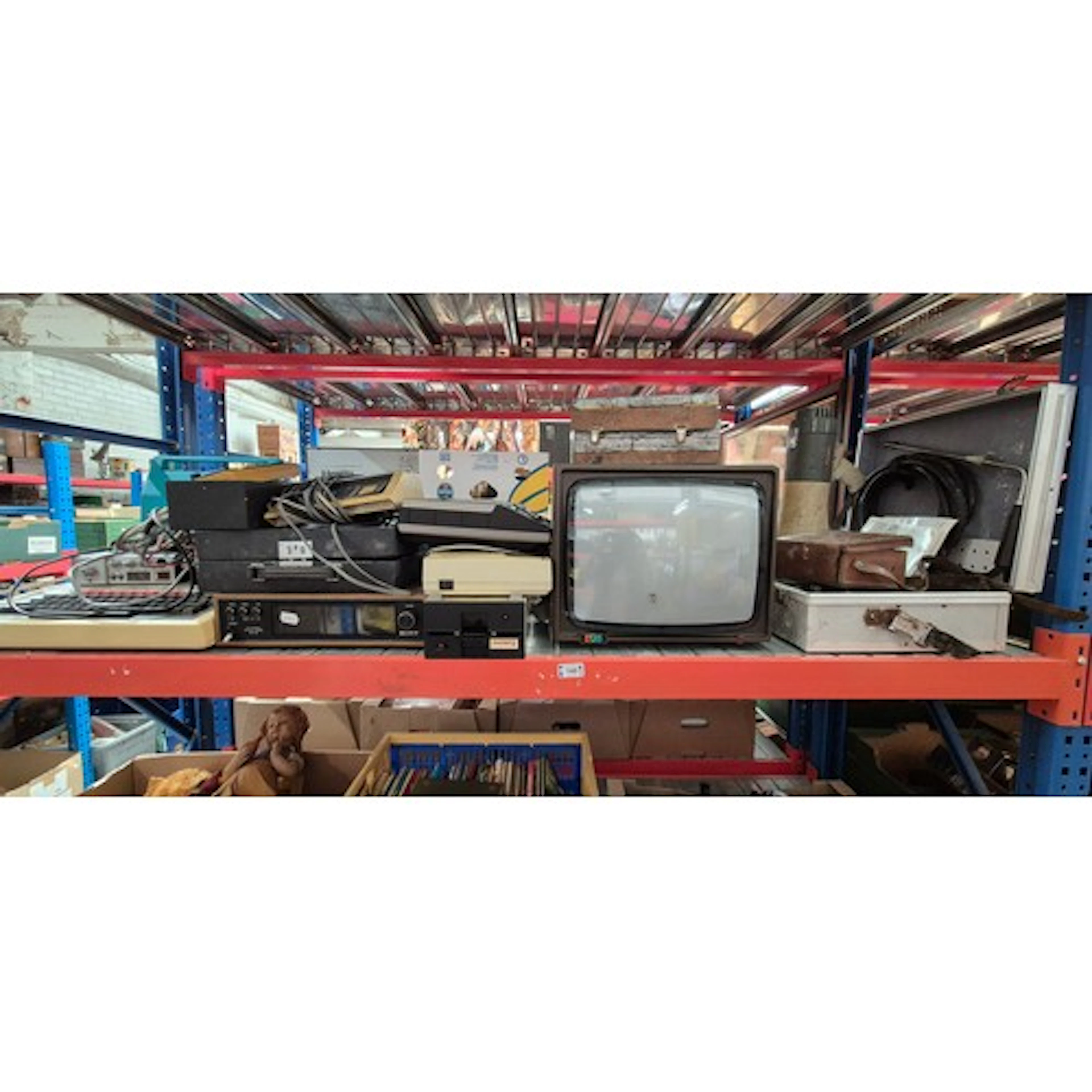 A shelf of electrical items to include Sony stereo tuner, Mi...