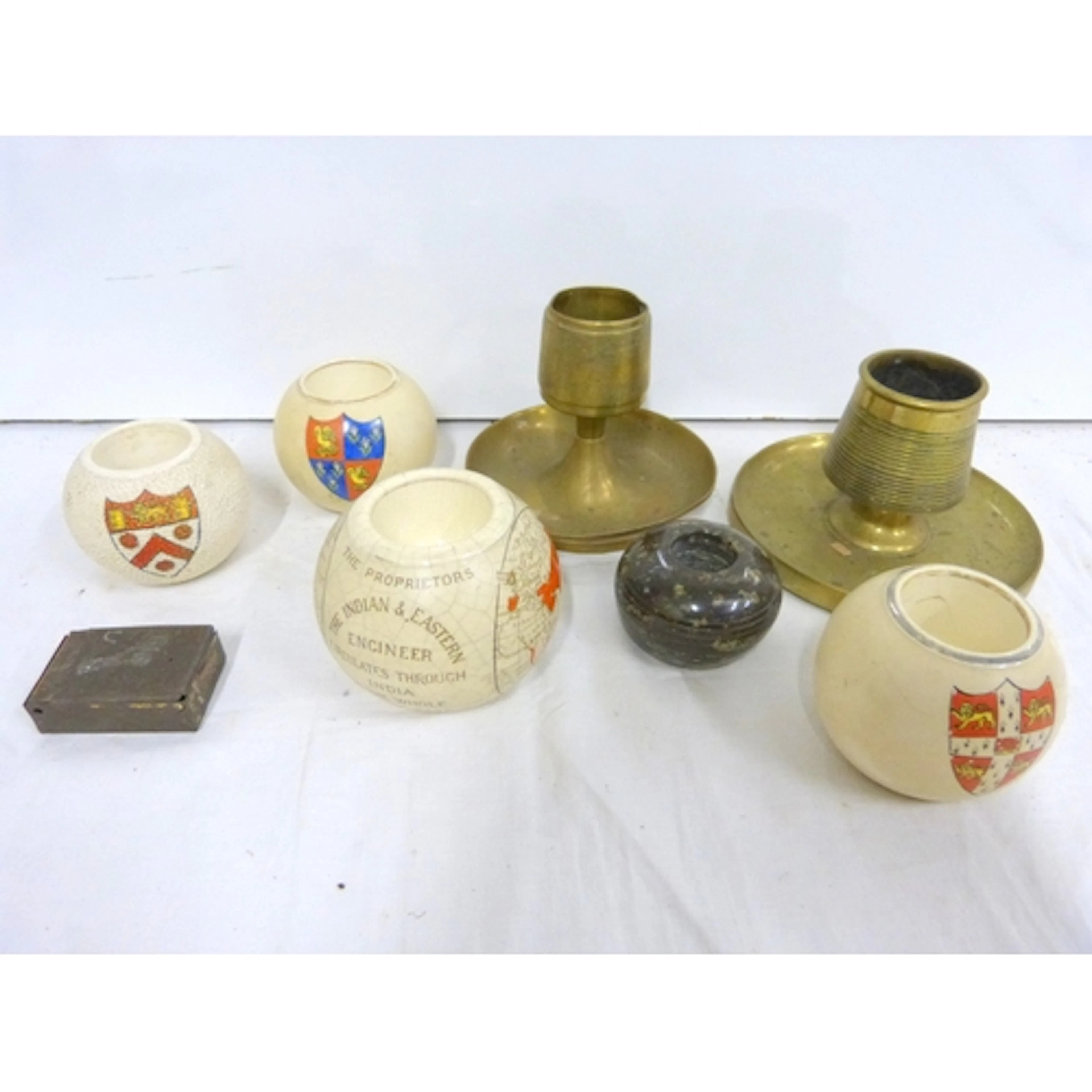 Collection of various ceramic and brass match holders.