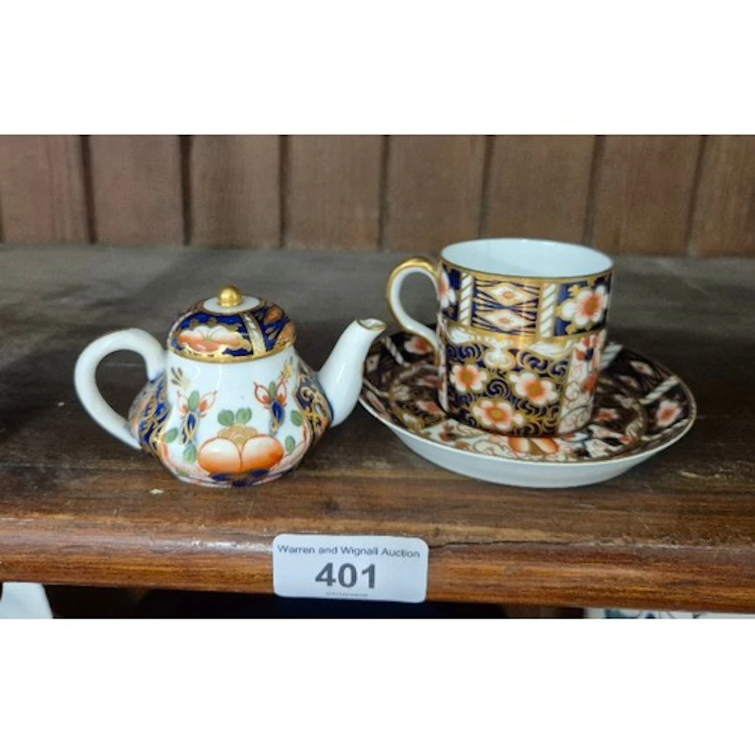 A Sampson Hancock, Derby miniature teapot, together with a R...