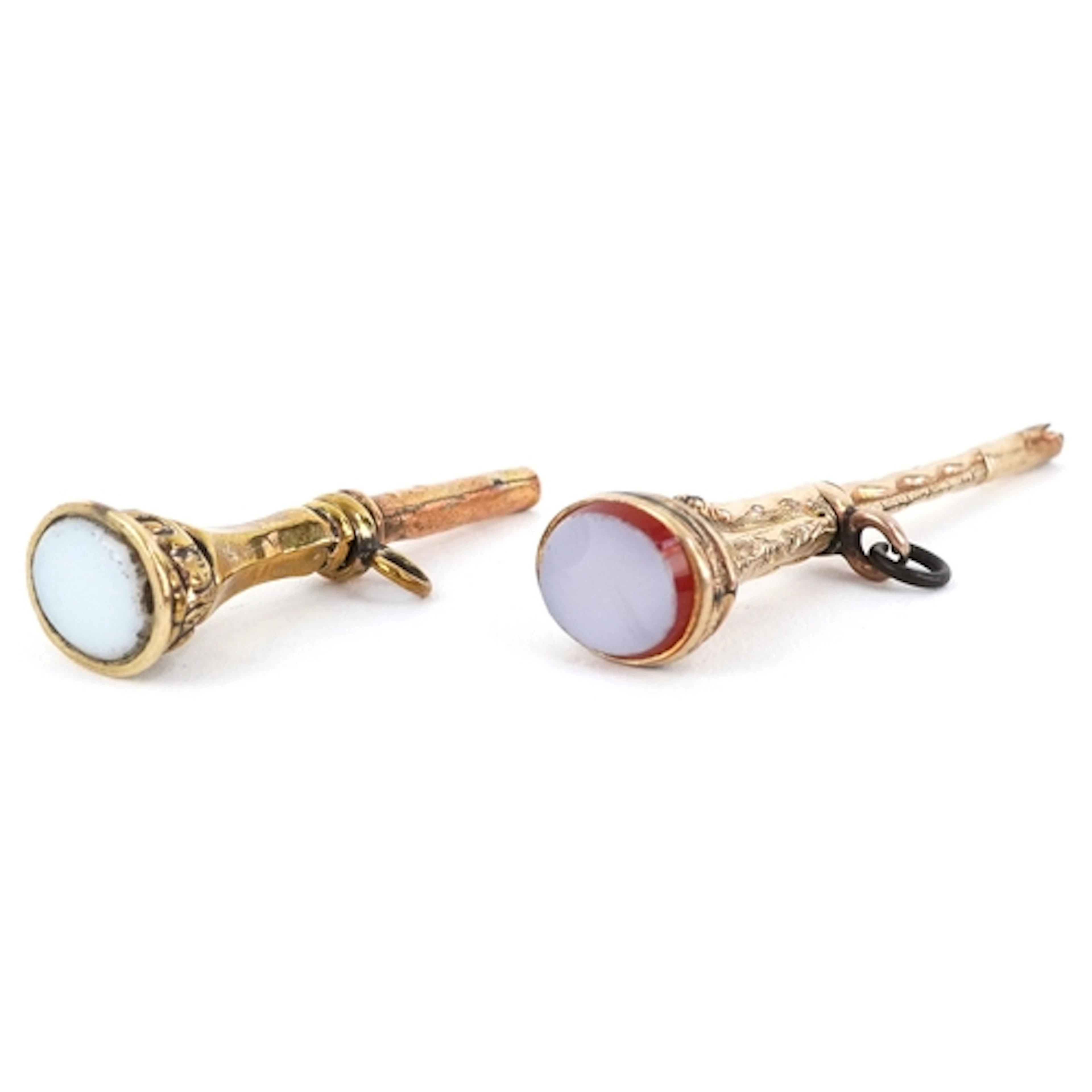 Two antique yellow metal sardonyx watch keys with unengraved...