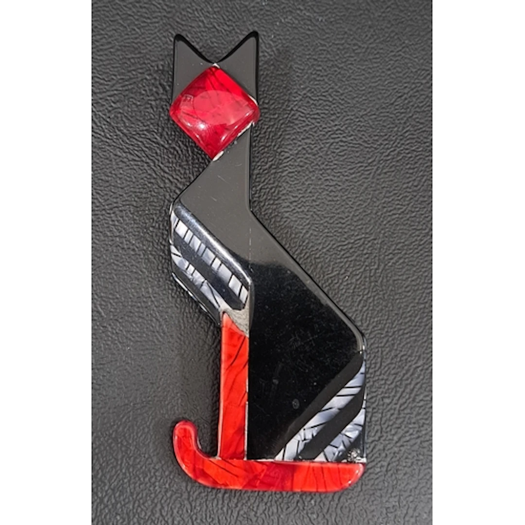 LEA STEIN ART DECO CAT BROOCH in black, red and silver, mark...