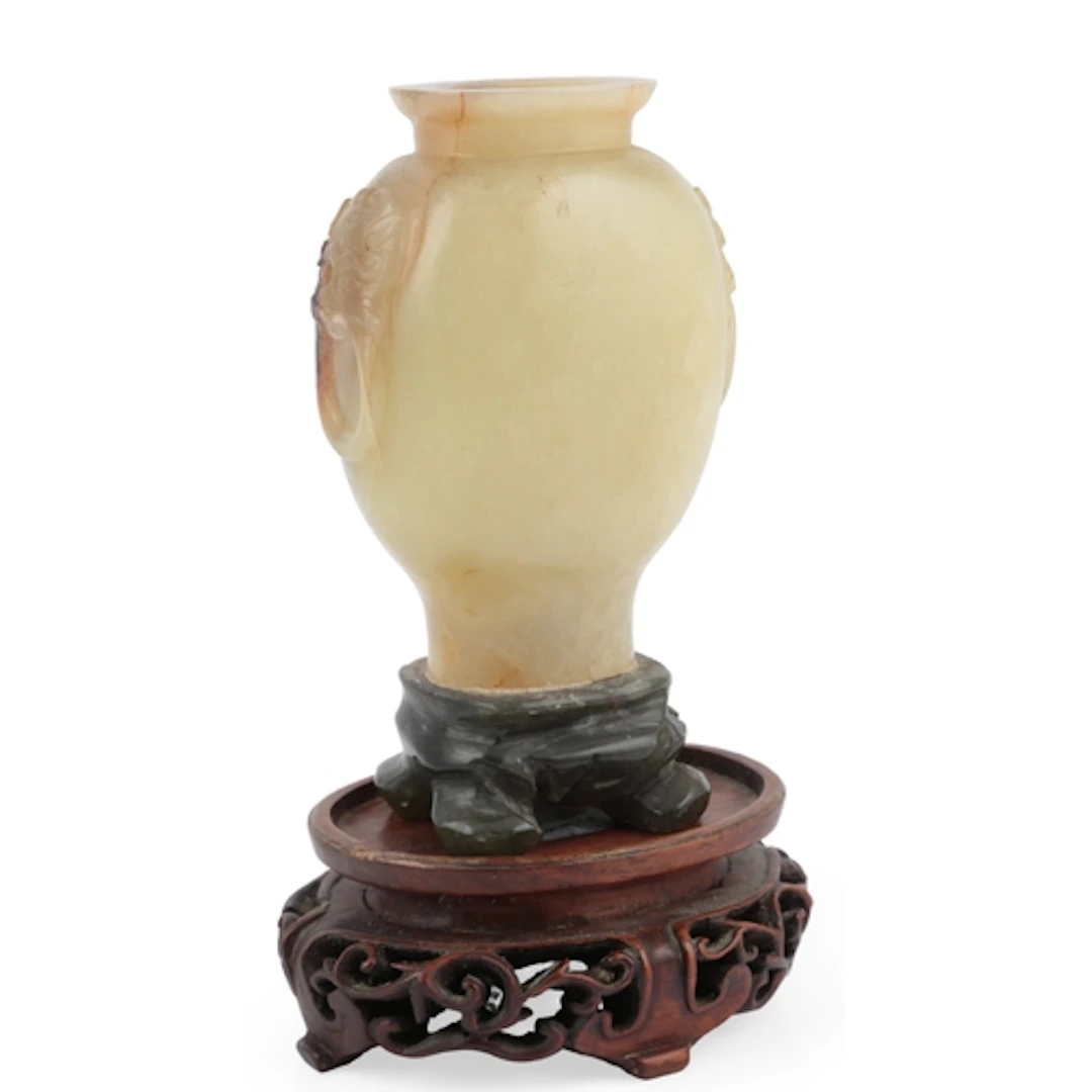 A Chinese greenish-yellow jade flattened baluster vase, earl...