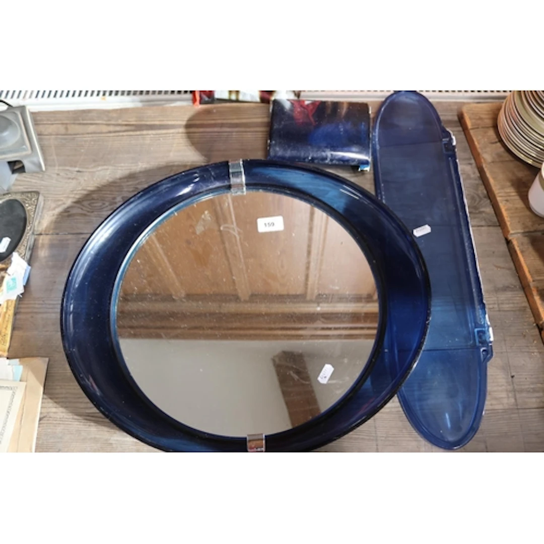 Retro toilet mirror set in chrome blue.