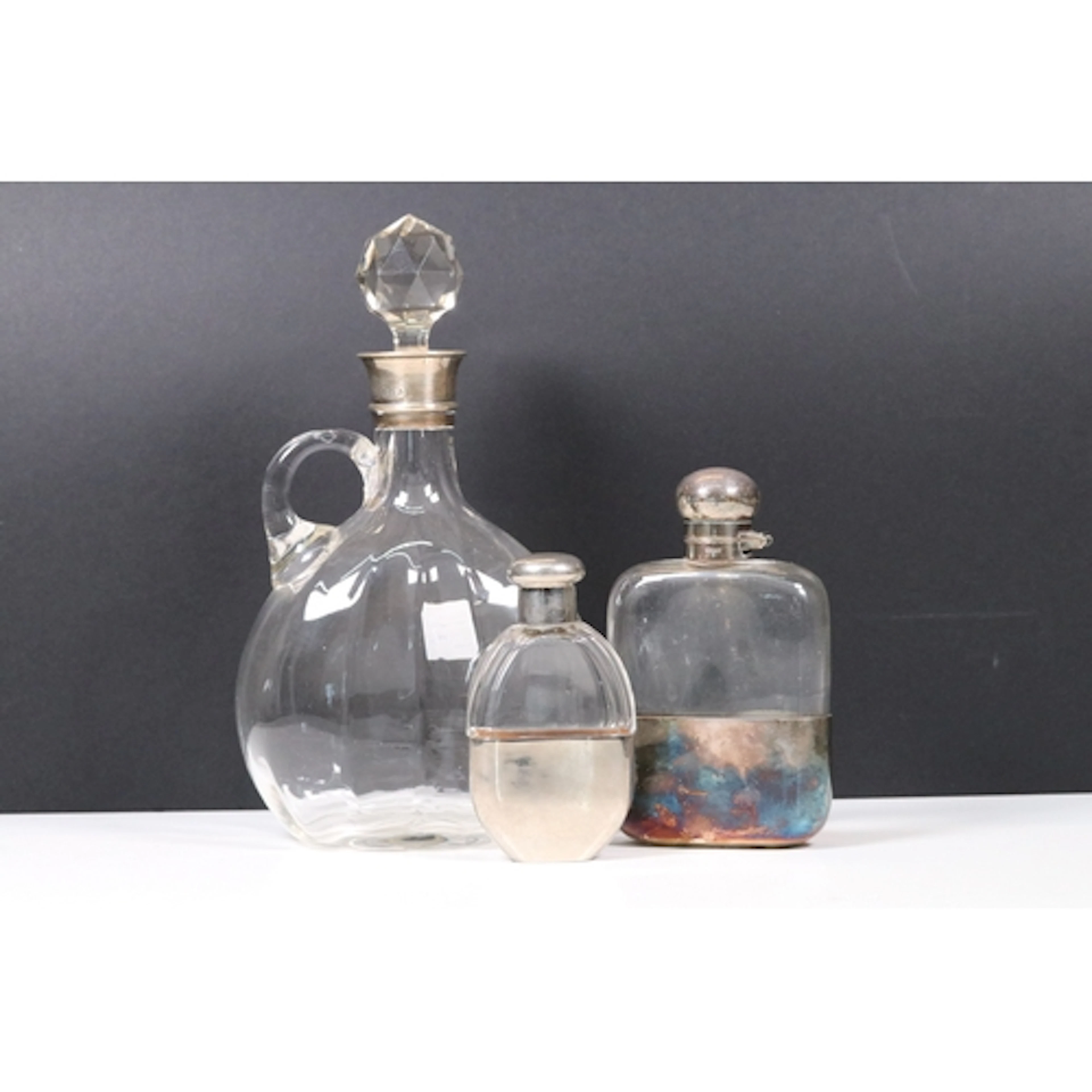 Three silver and silver plated topped glass drinking items t...