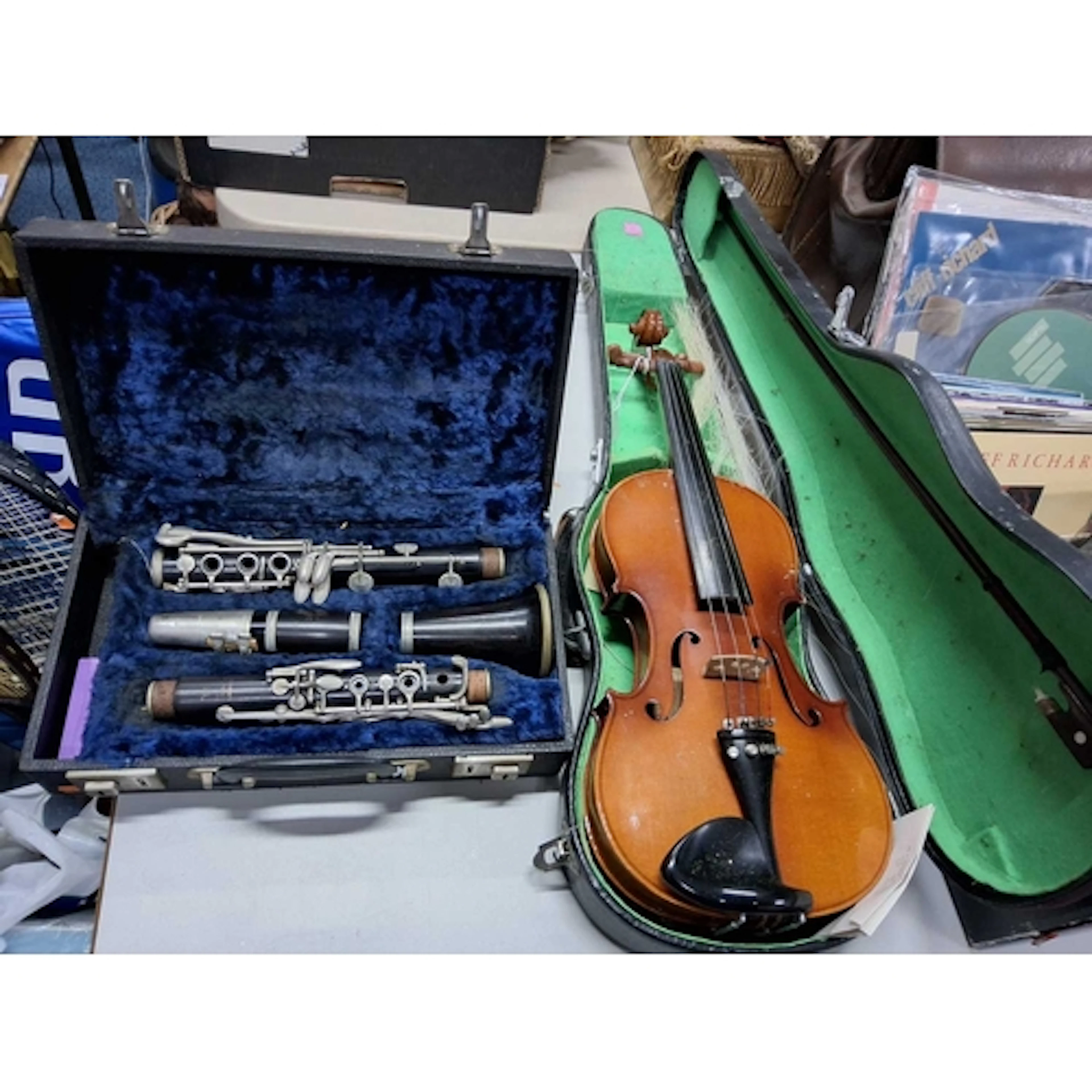A Cased Violin, made in China with one steel string in an en...