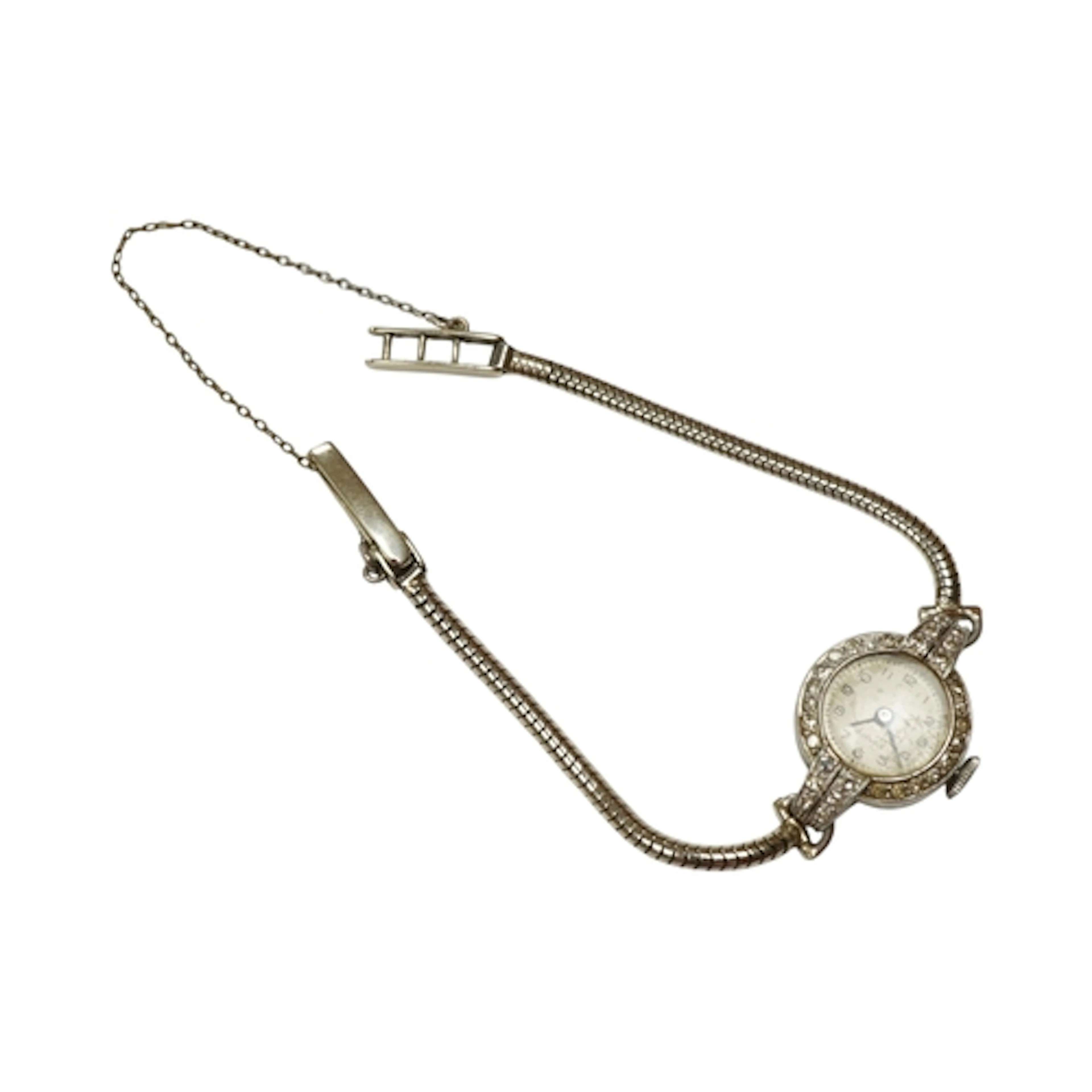 A lady's white metal, stamped plat and diamond set cocktail ...