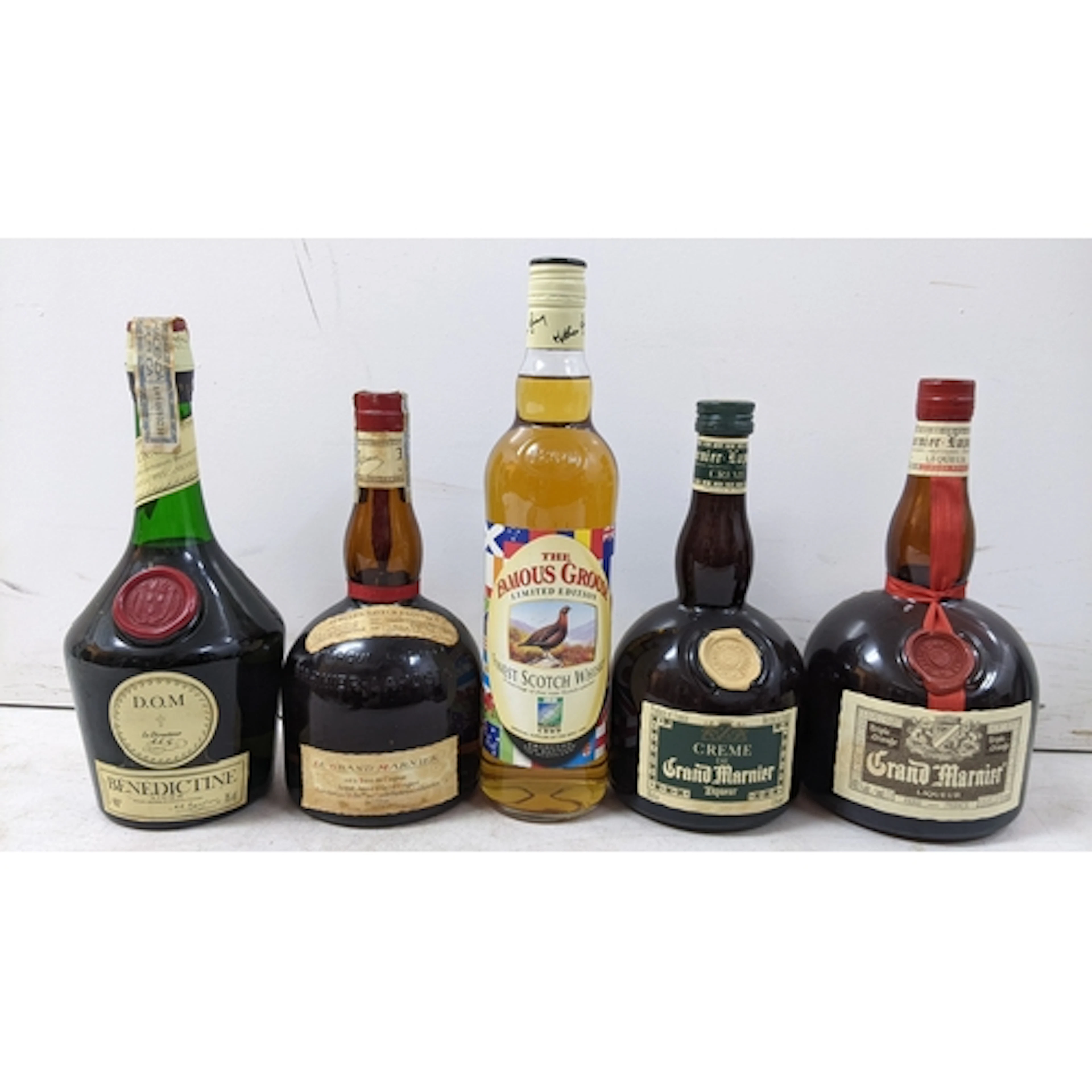 A mixed group of five bottles of whisky and liqueurs, compri...