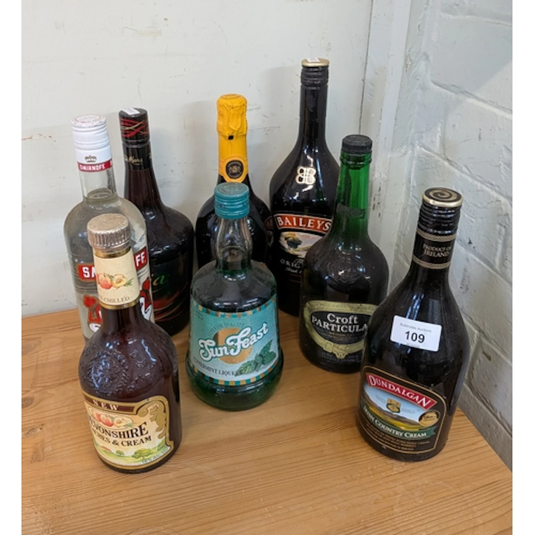 A bottle of Vodka together with Tia Maria, Bailey's Irish Cr...