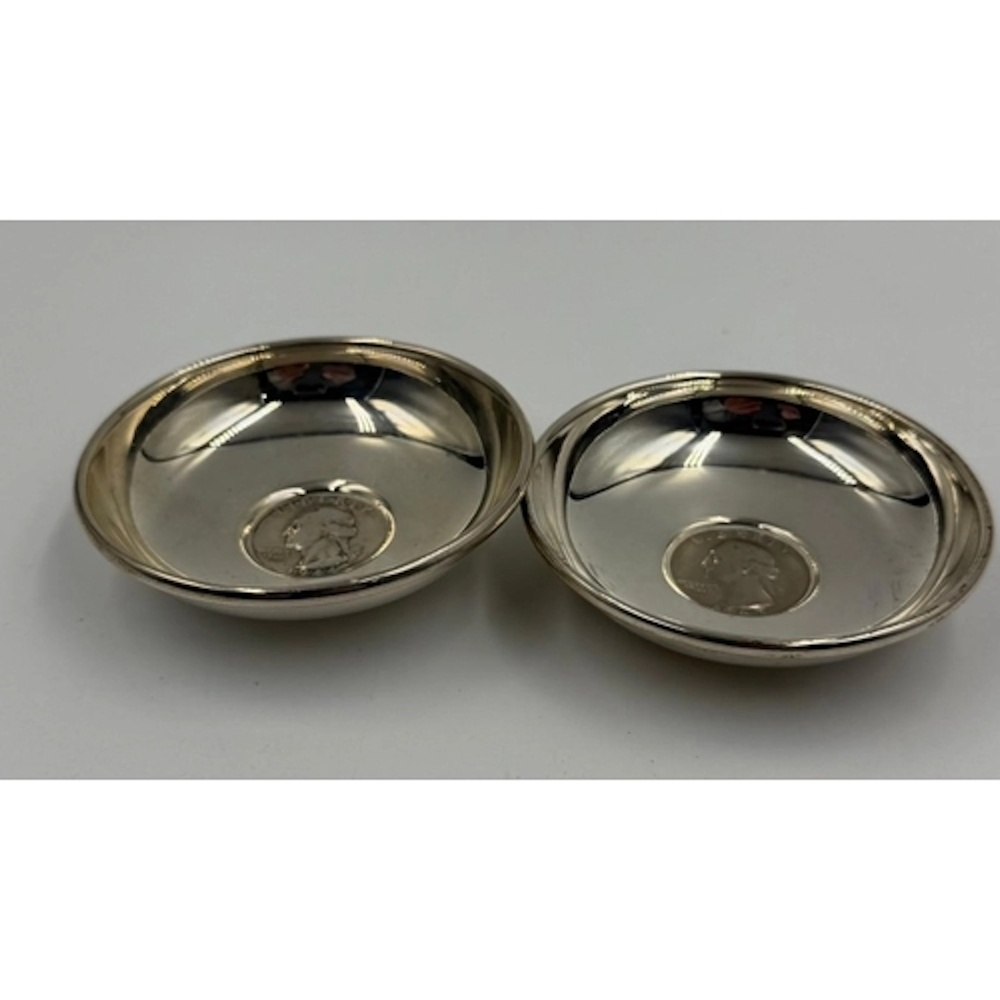 A pair of Sterling silver pin dishes with US quarter dollar ...