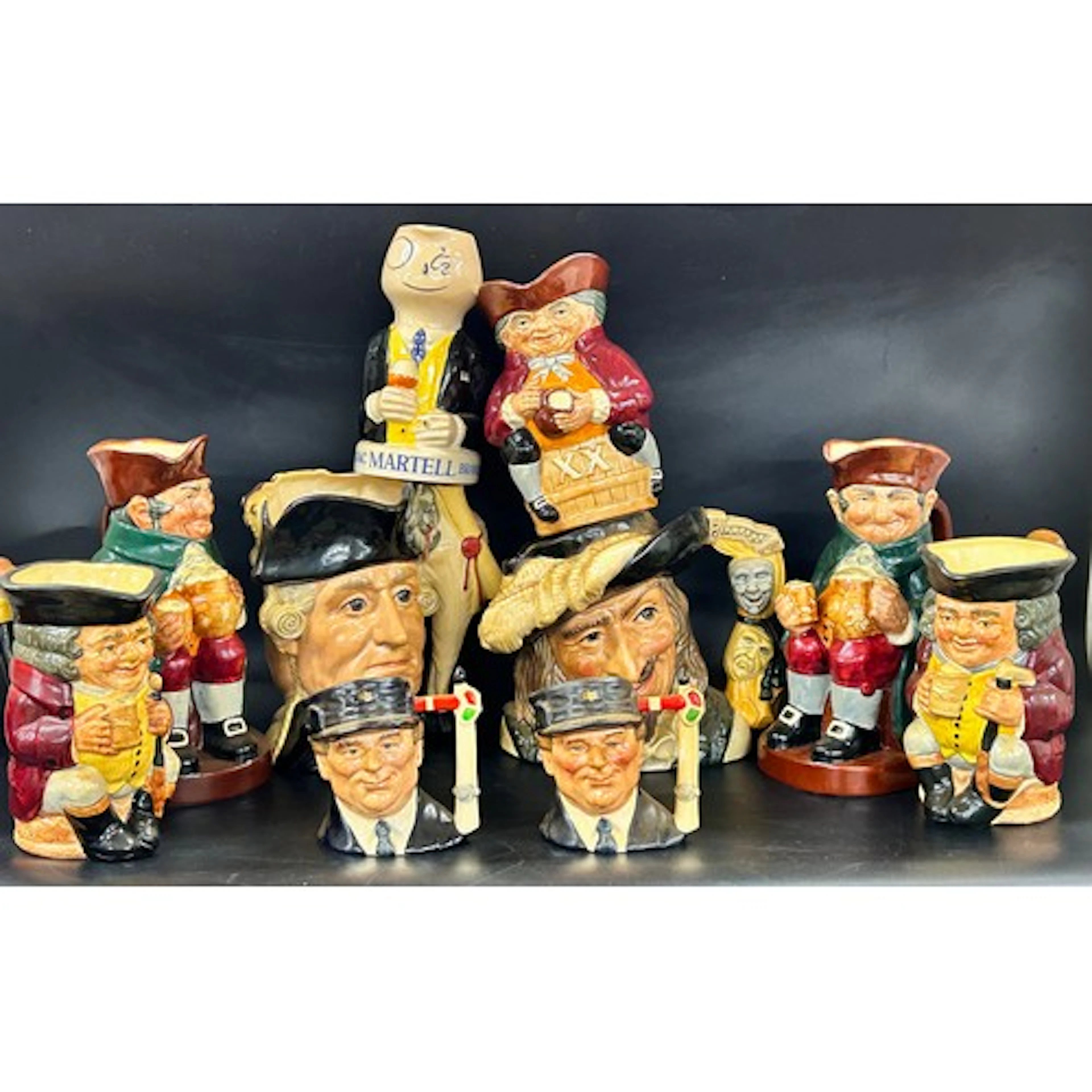 A collection of large and small Toby Jugs - mostly Royal Dou...
