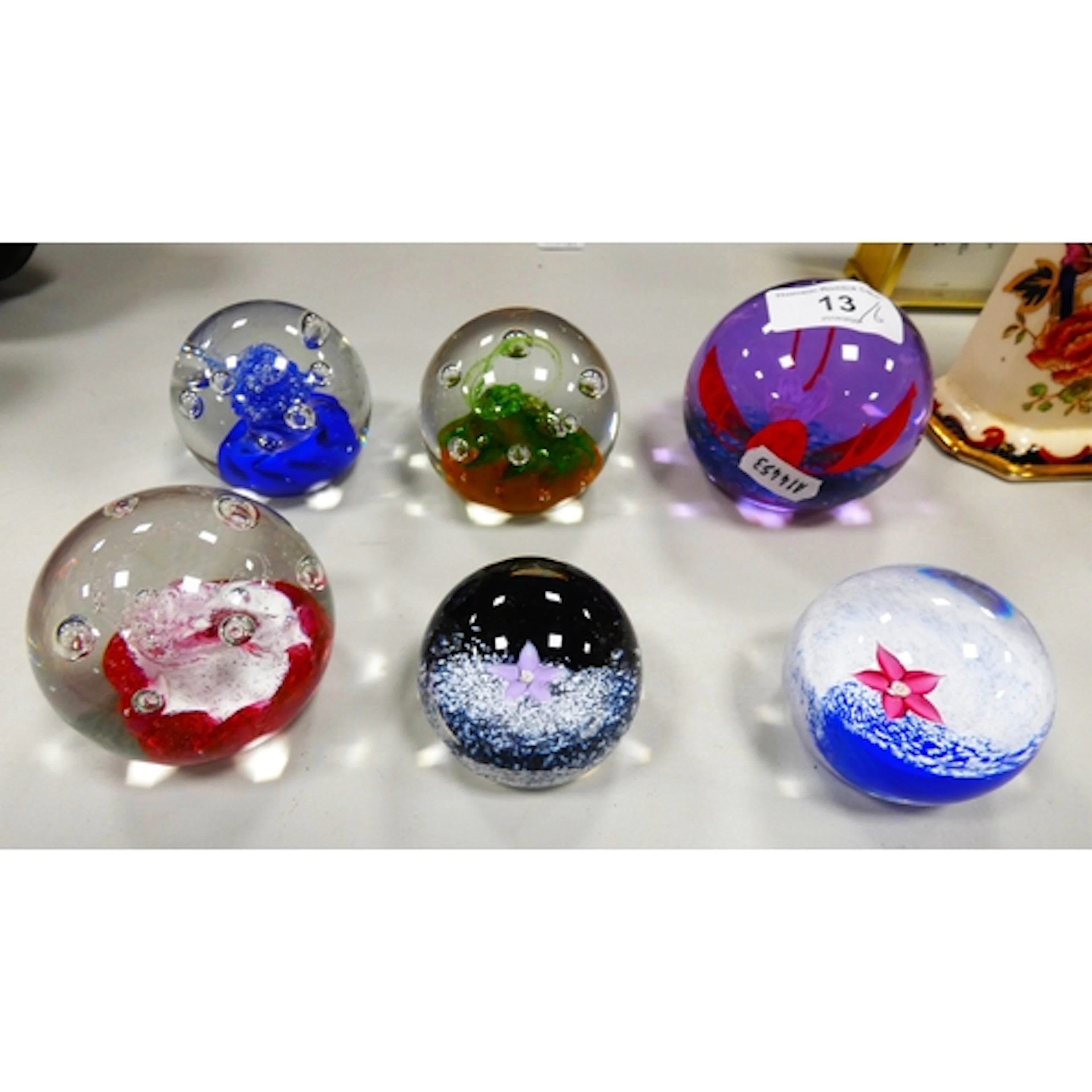 Six Limited Edition glass paperweights by Caithness to inclu...