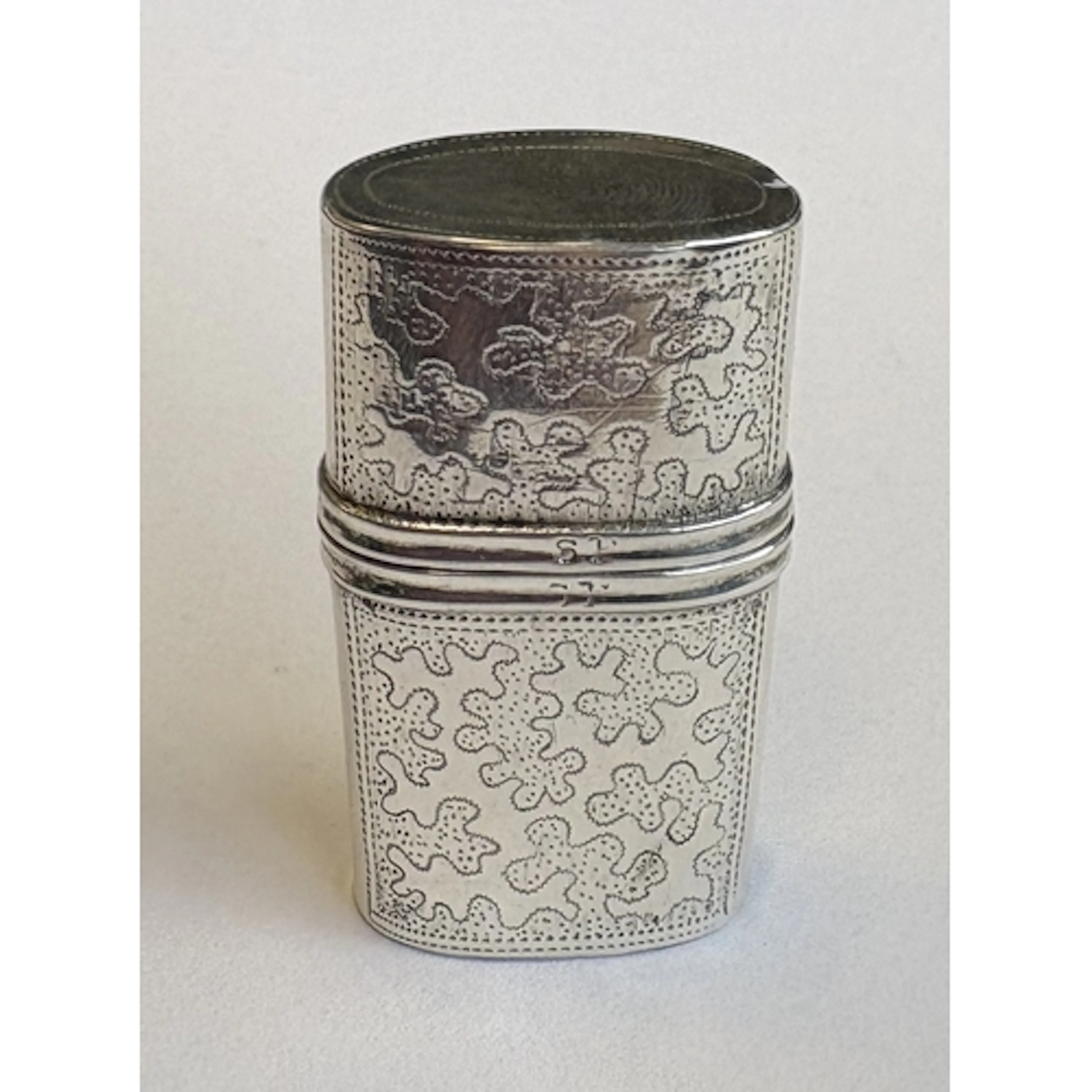 A Georgian silver perfume case with engraved decoration cont...