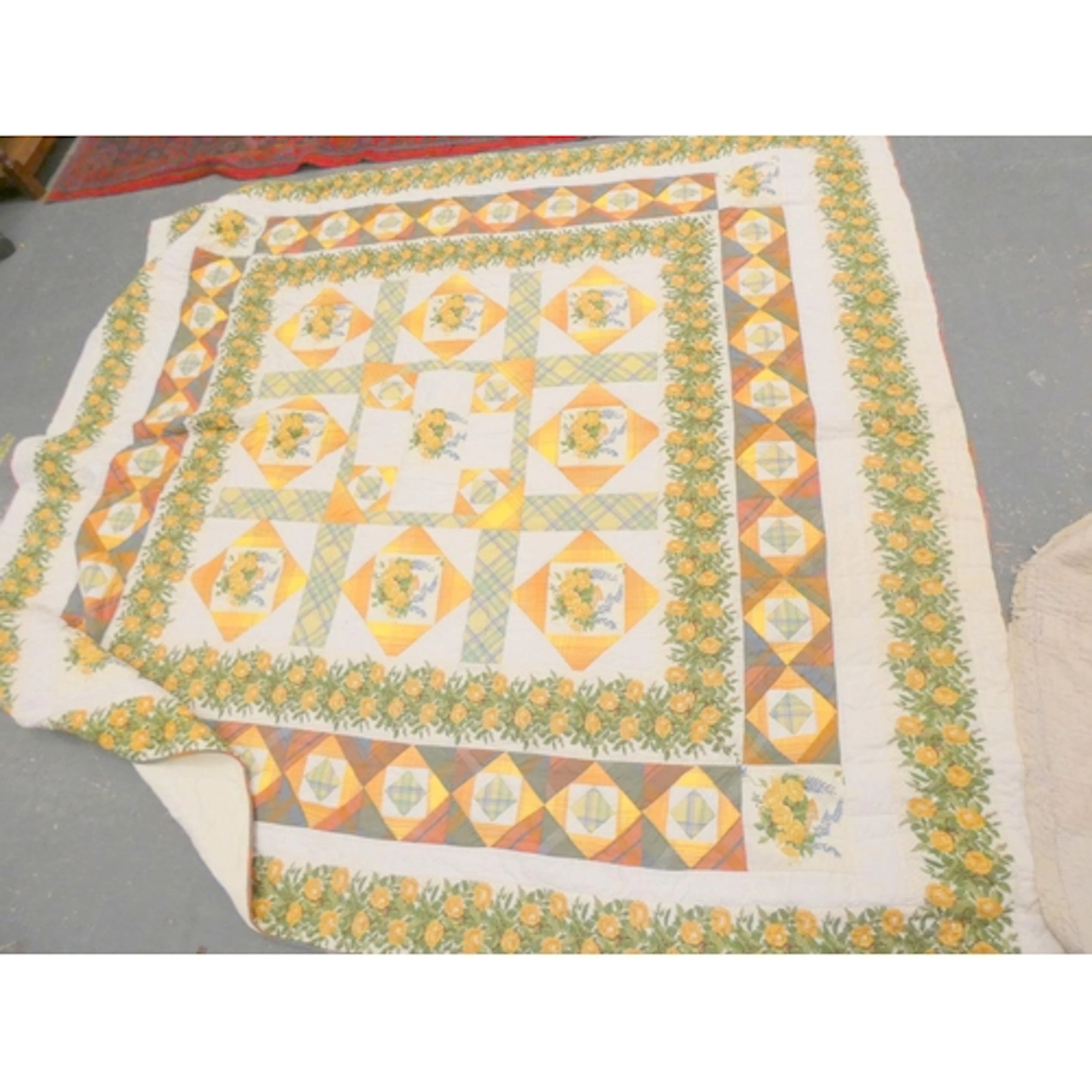 Two antique patchwork quilts and a modern example.