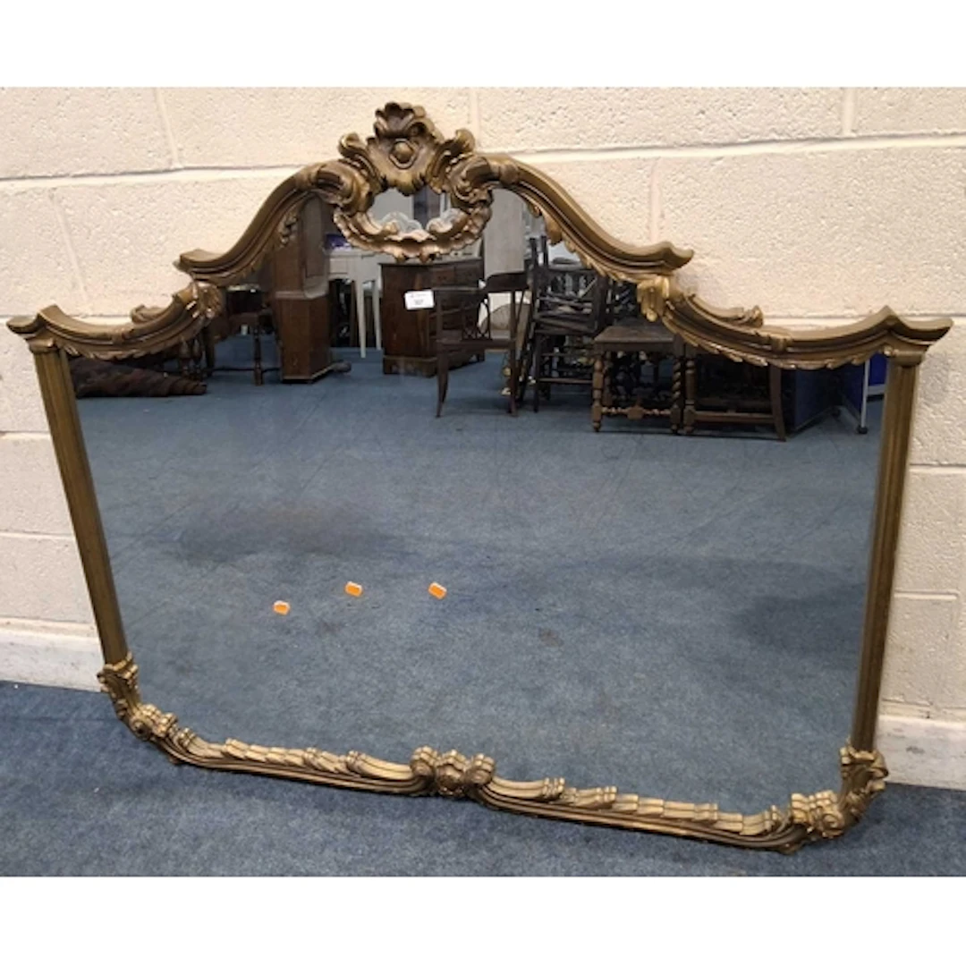 A MODERN GILT FRAME WALL MIRROR, with scrolled and foliate d...