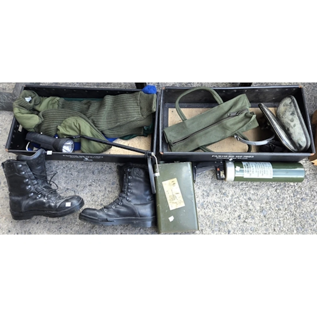 Two 1986 military boxes with various military items includin...