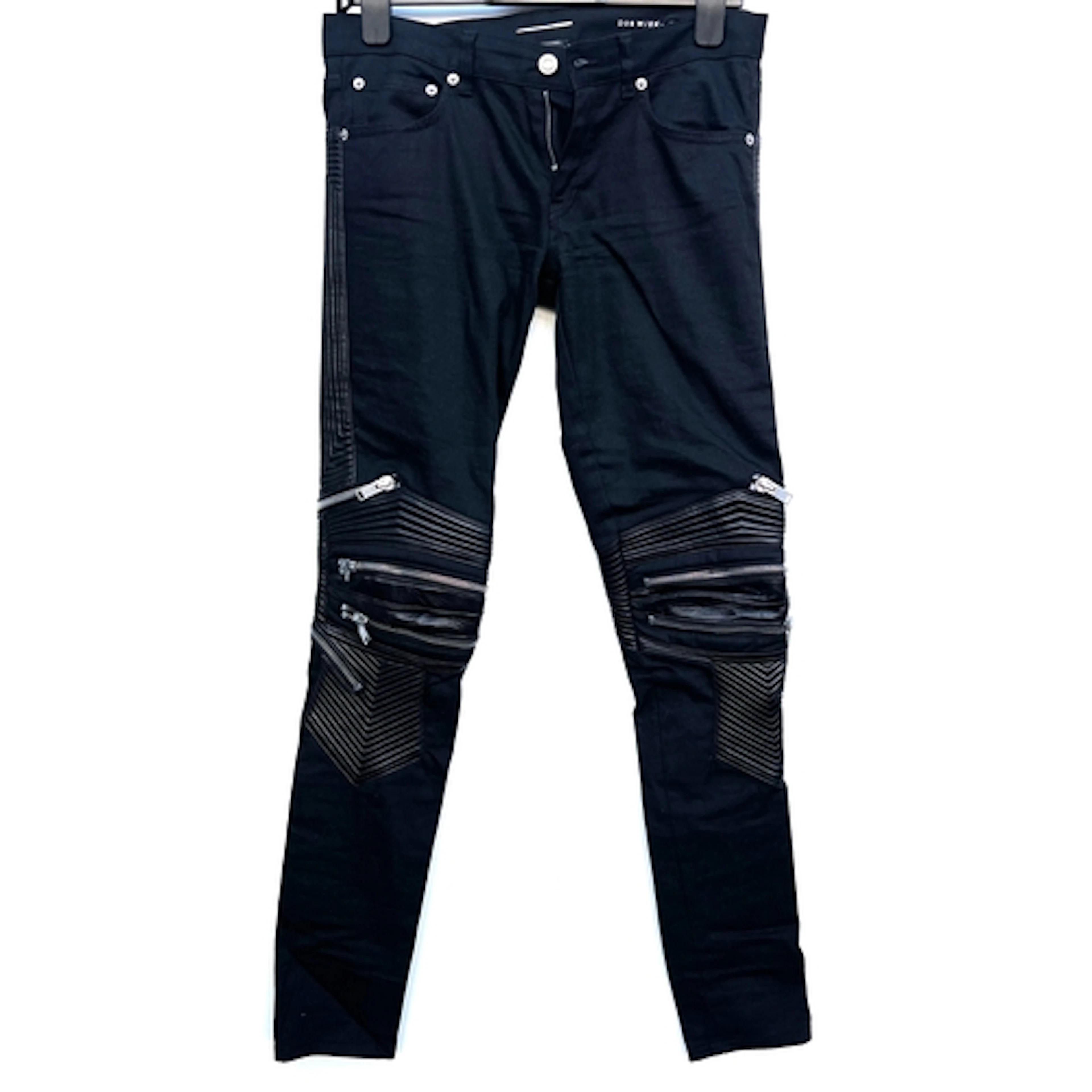 A pair of Saint Laurent black denim trousers with leather st...