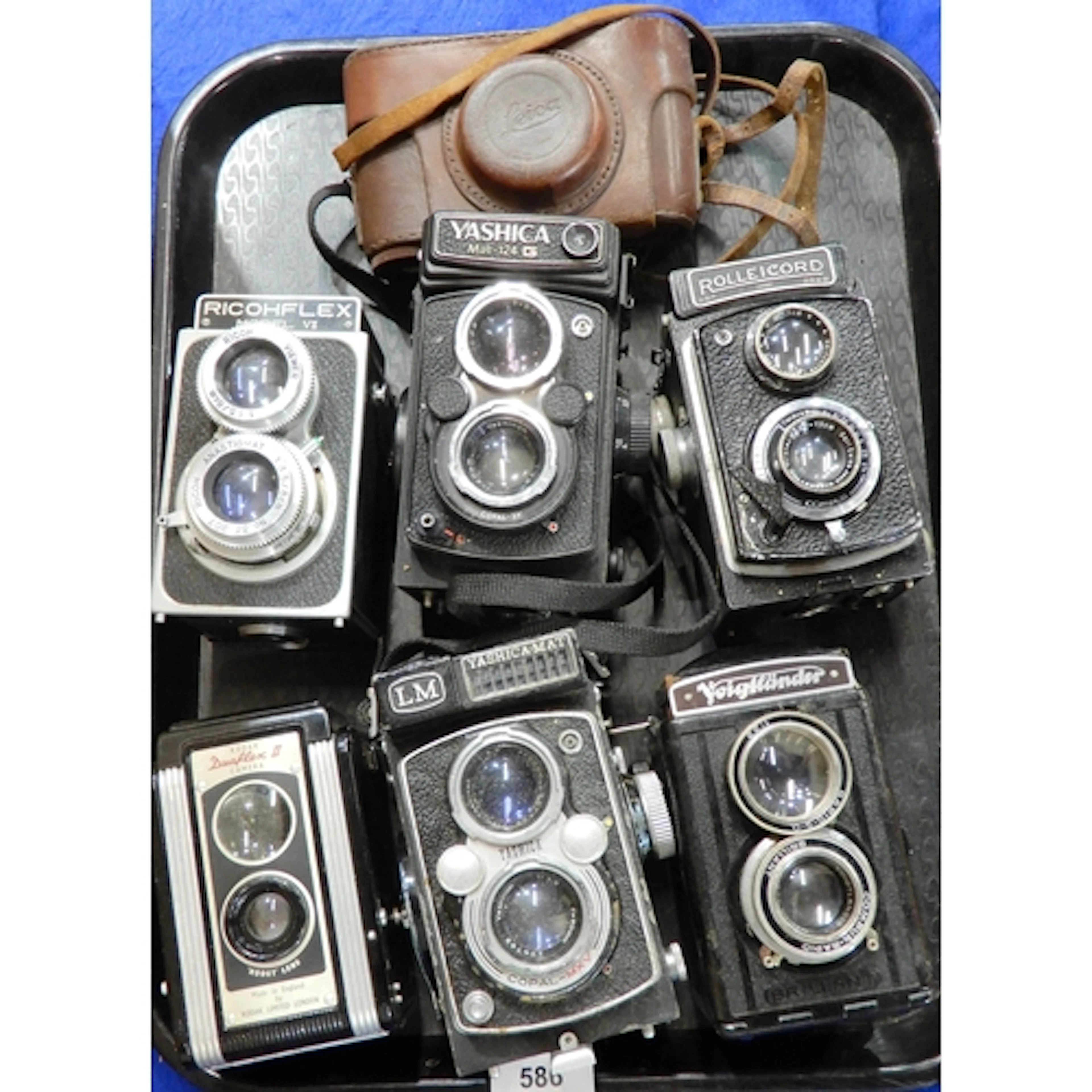 Six various twin-lens cameras, including Rolleicord, Voigtla...
