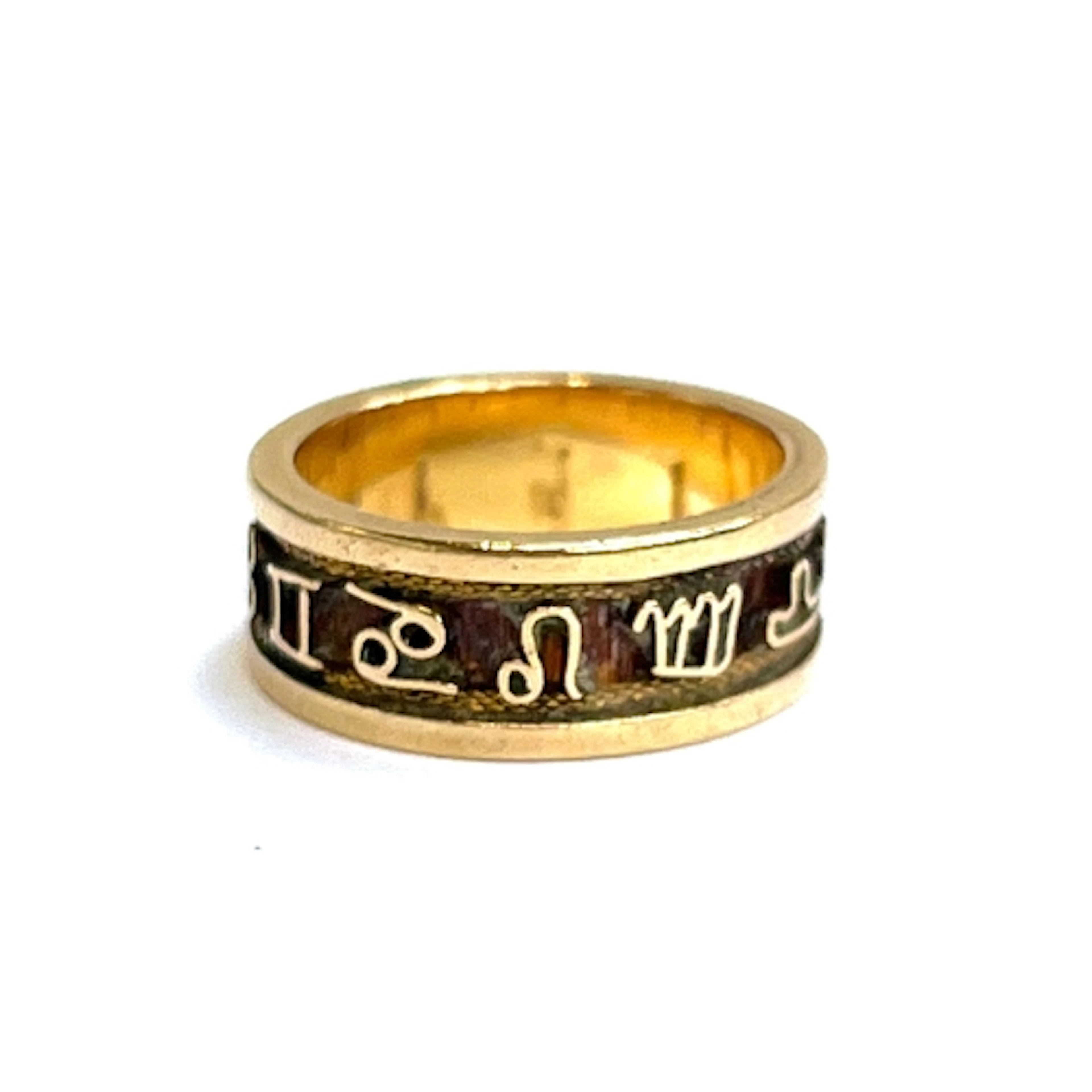 A gold Zodiac ring, tests as 14ct or higher, size M 1/2, 7g