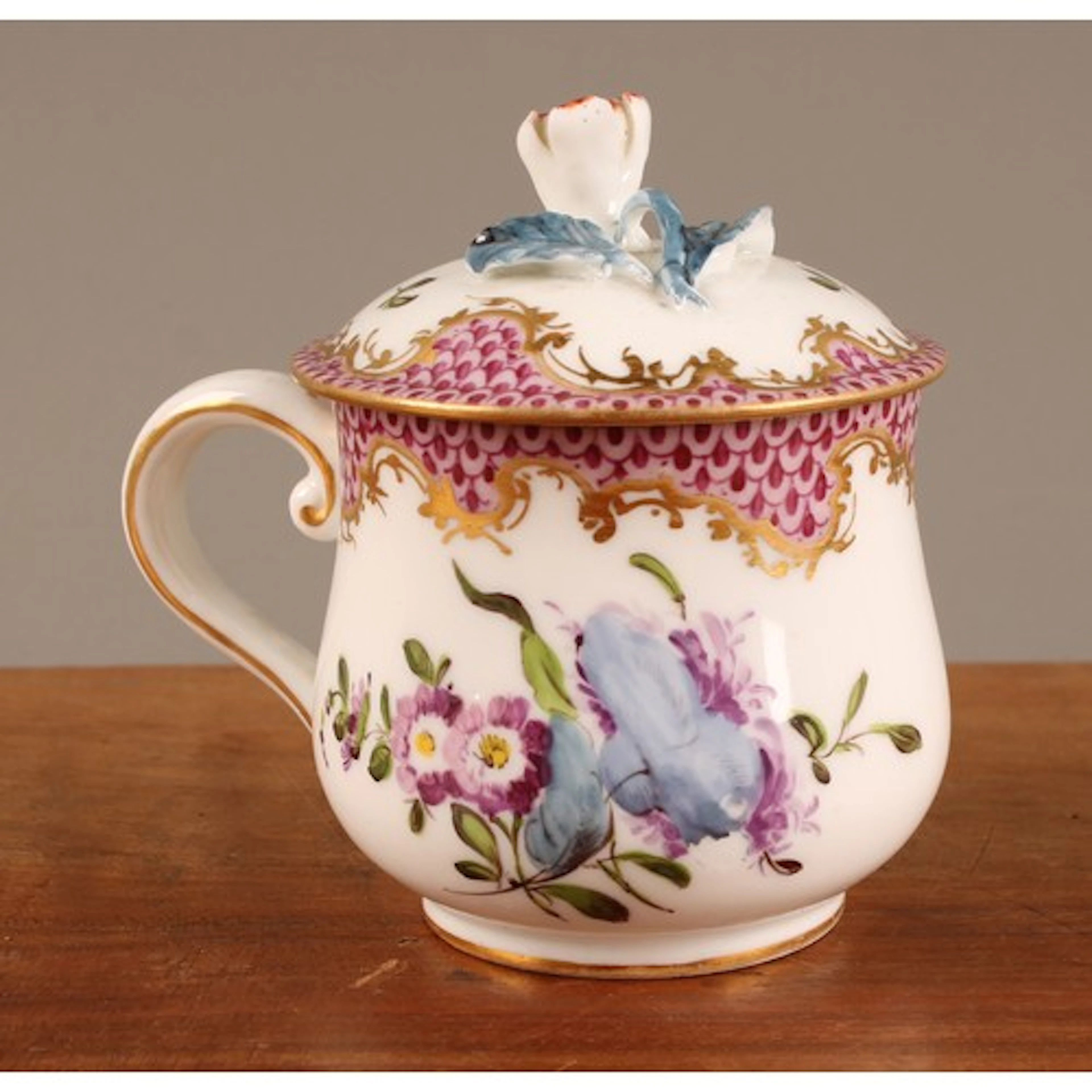 A Vienna custard cup and cover, painted with flowers under a...