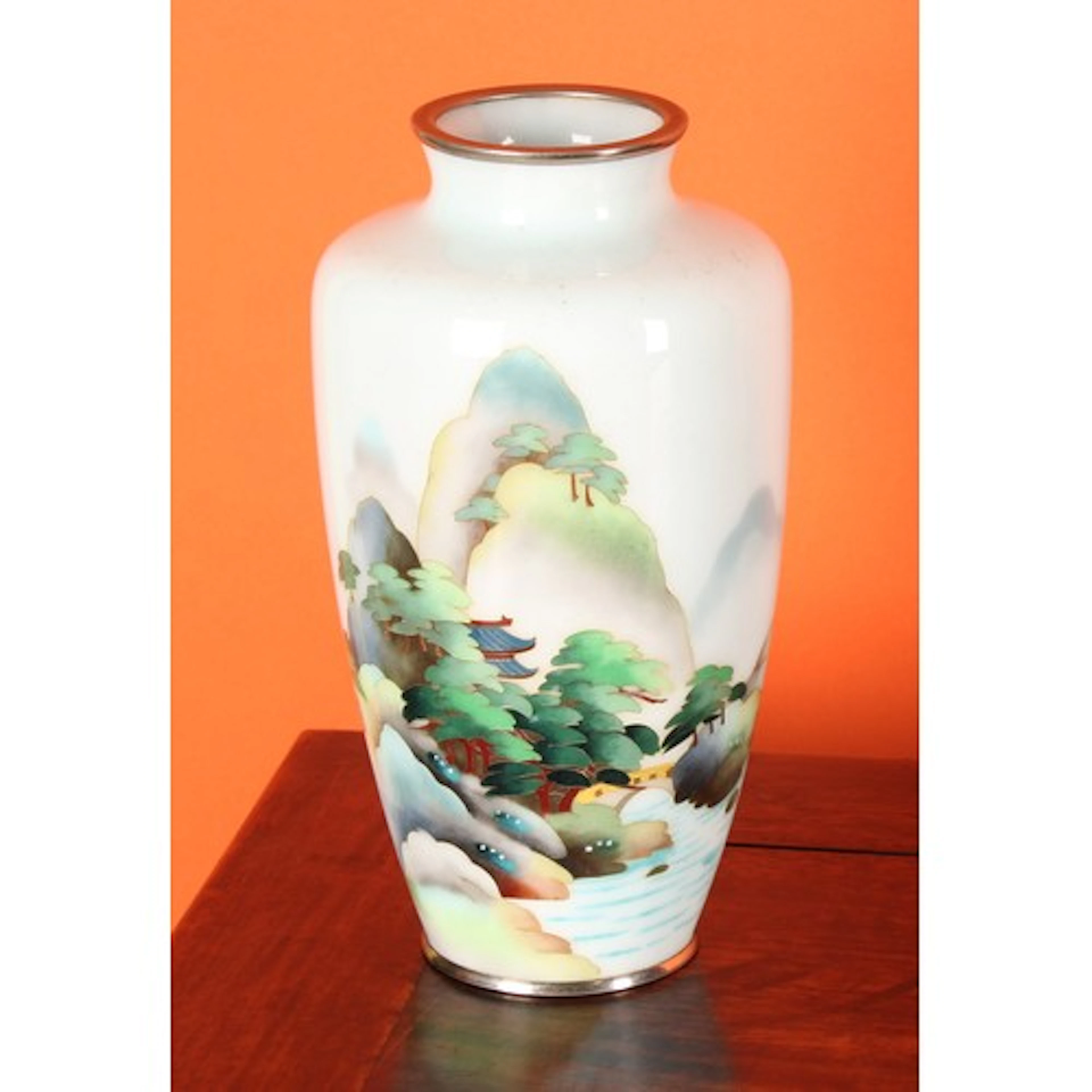 A Japanese cloisonne enamel ovoid vase, decorated in polychr...