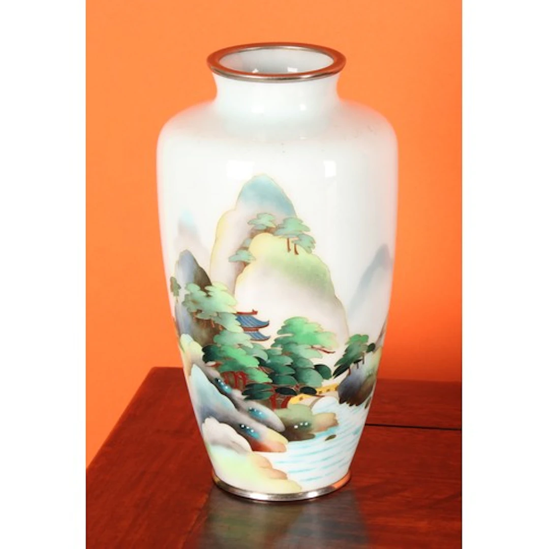 A Japanese cloisonne enamel ovoid vase, decorated in polychr...