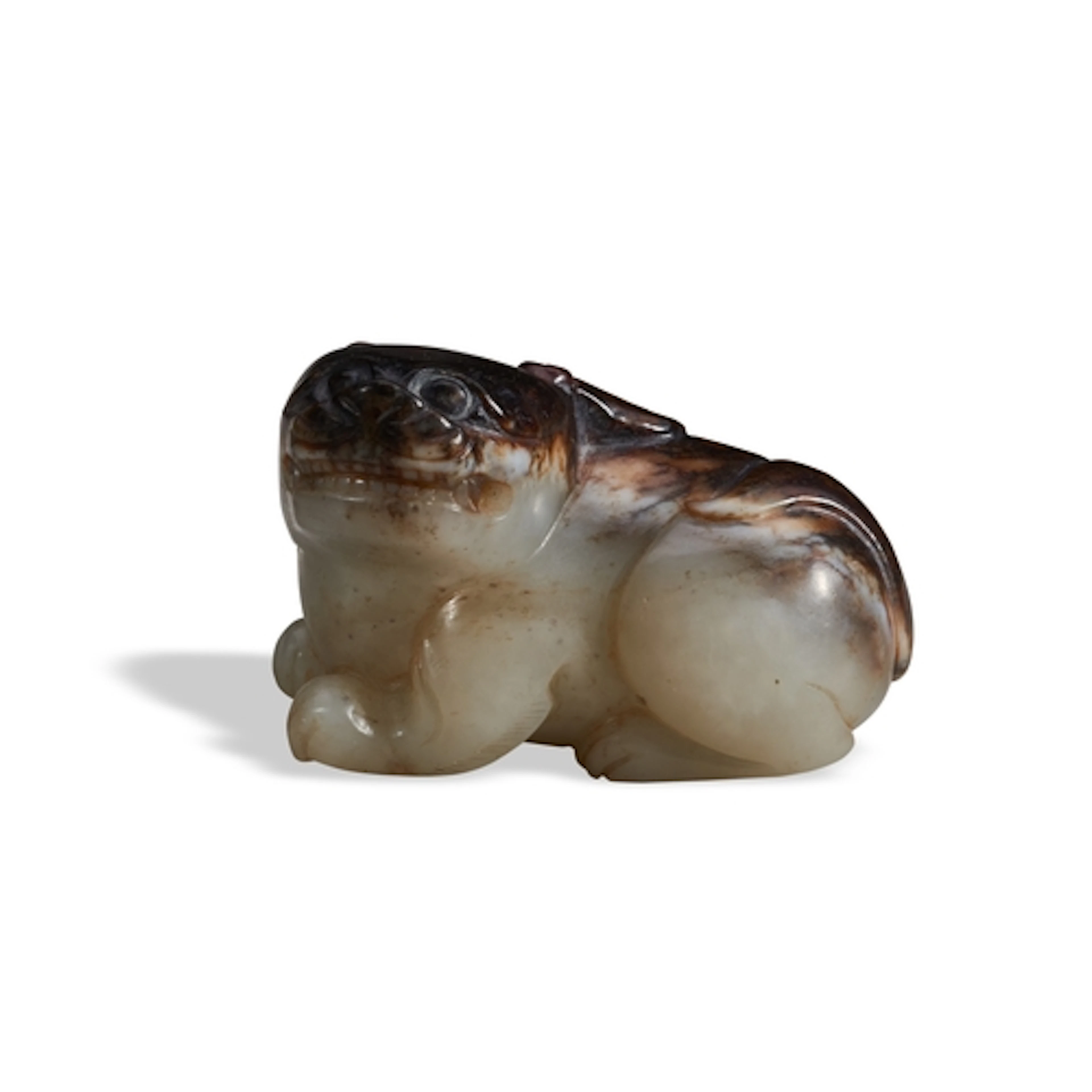 A CELADON-BROWN JADE HORNED LION QING DYNASTY, 19TH CENTURY ...