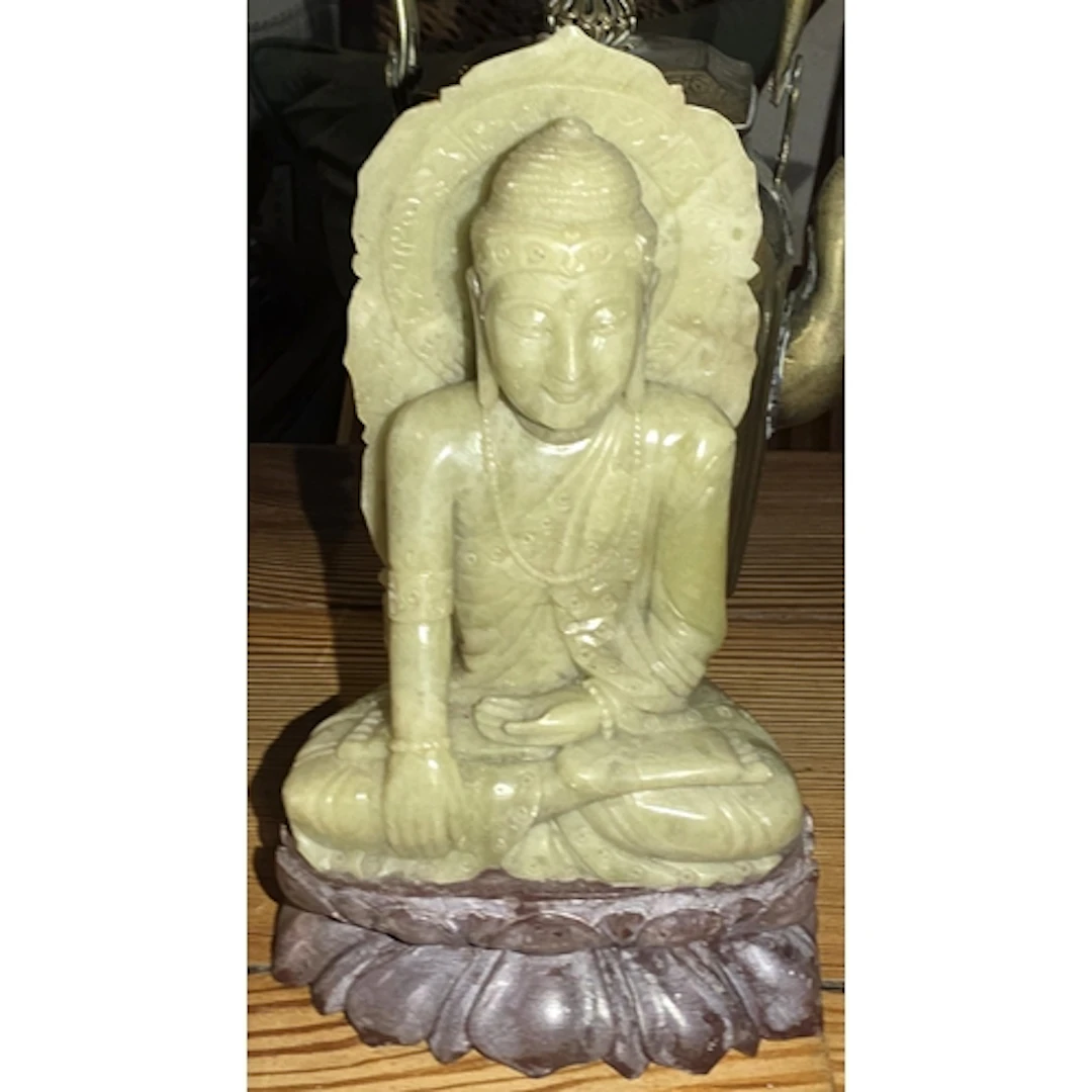 A Chinese pale green soapstone buddha figure, ht. 16cm.