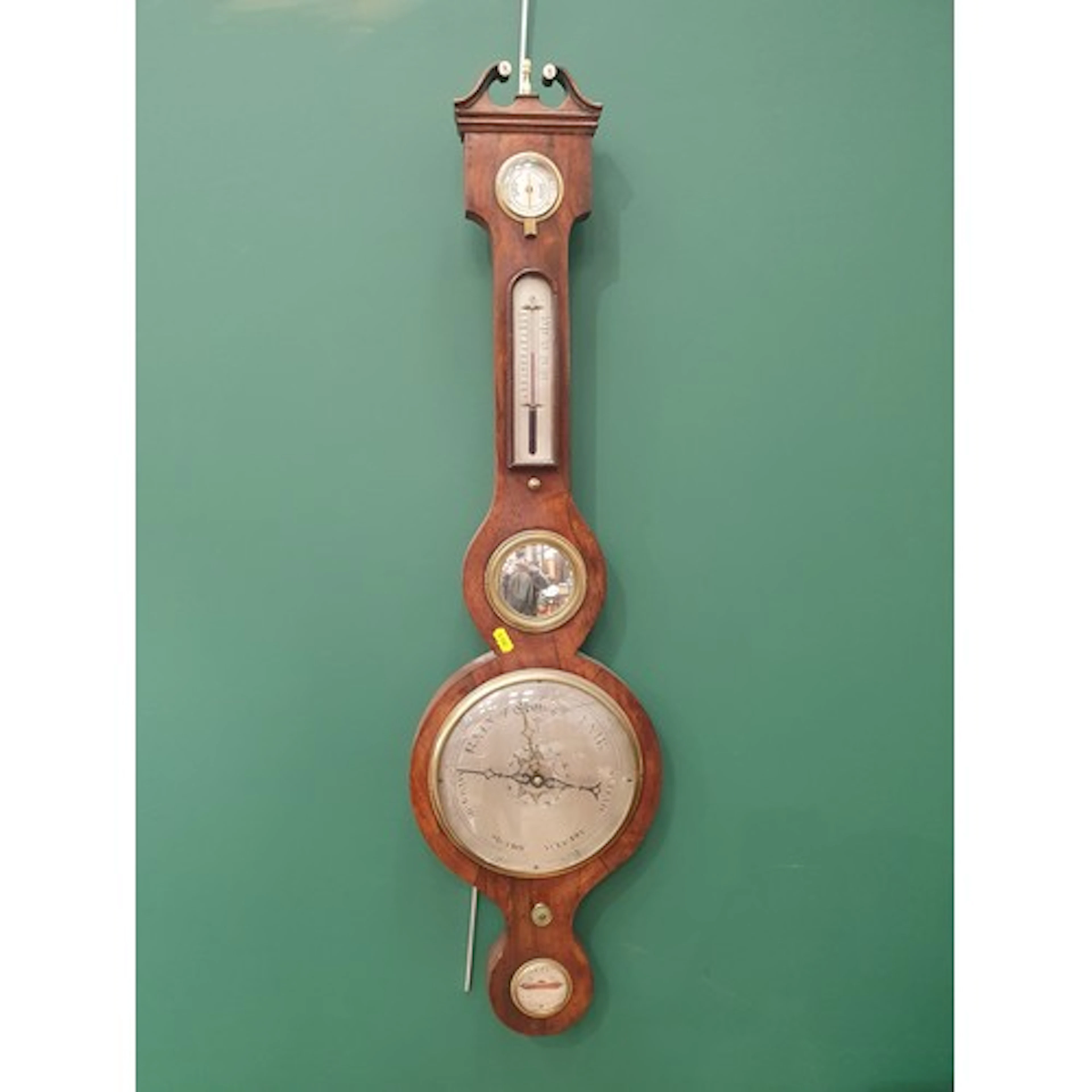 A 19th Century rosewood Wheel Barometer/Thermometer with swa...