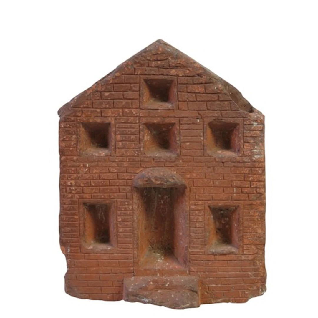 A FOLK ART DOOR STOP MODELLED AS A TOWN HOUSE Possibly an en...