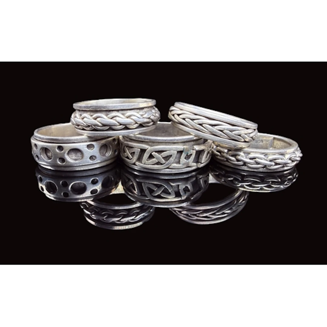 A collection of five white metal gents rings various designs...