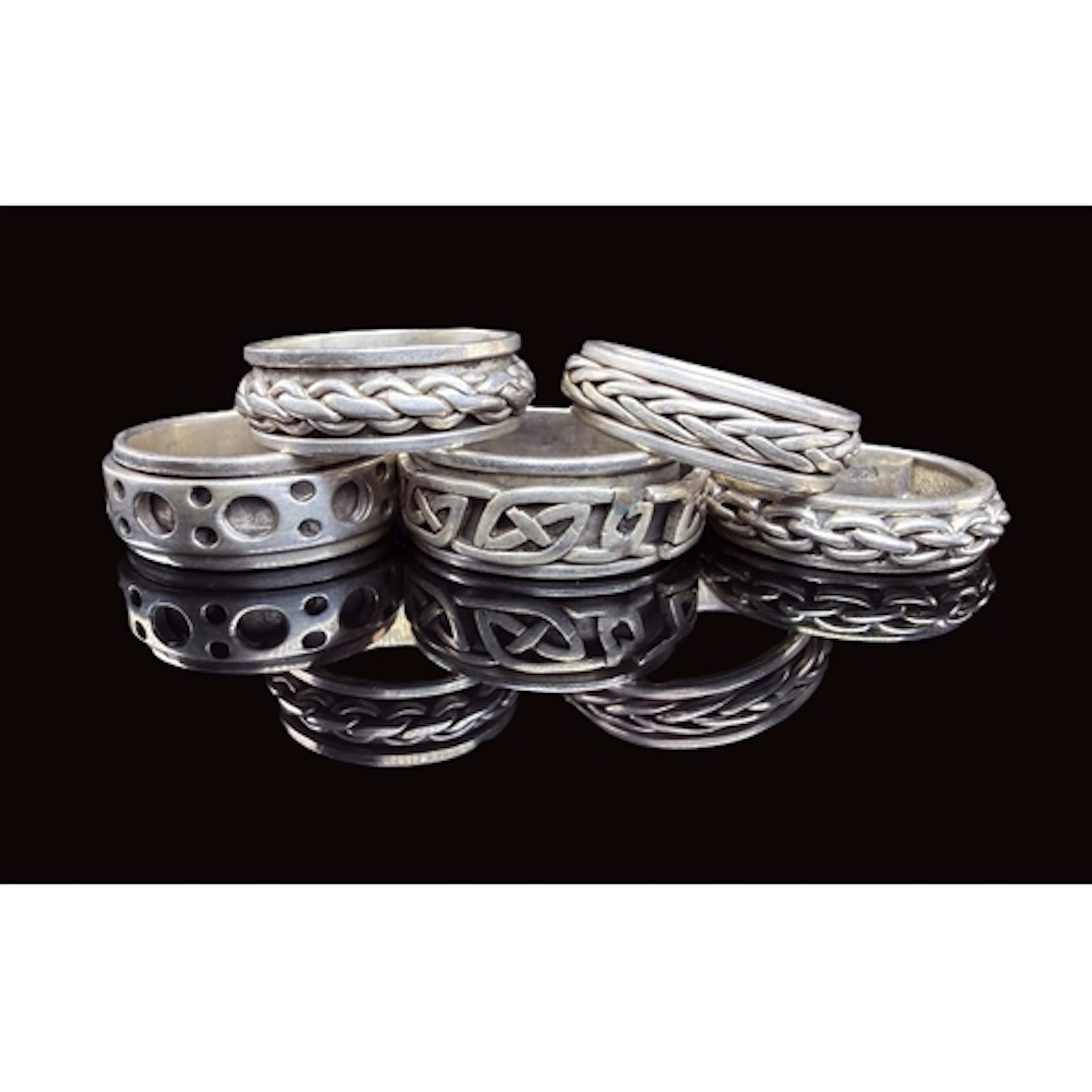A collection of five white metal gents rings various designs...