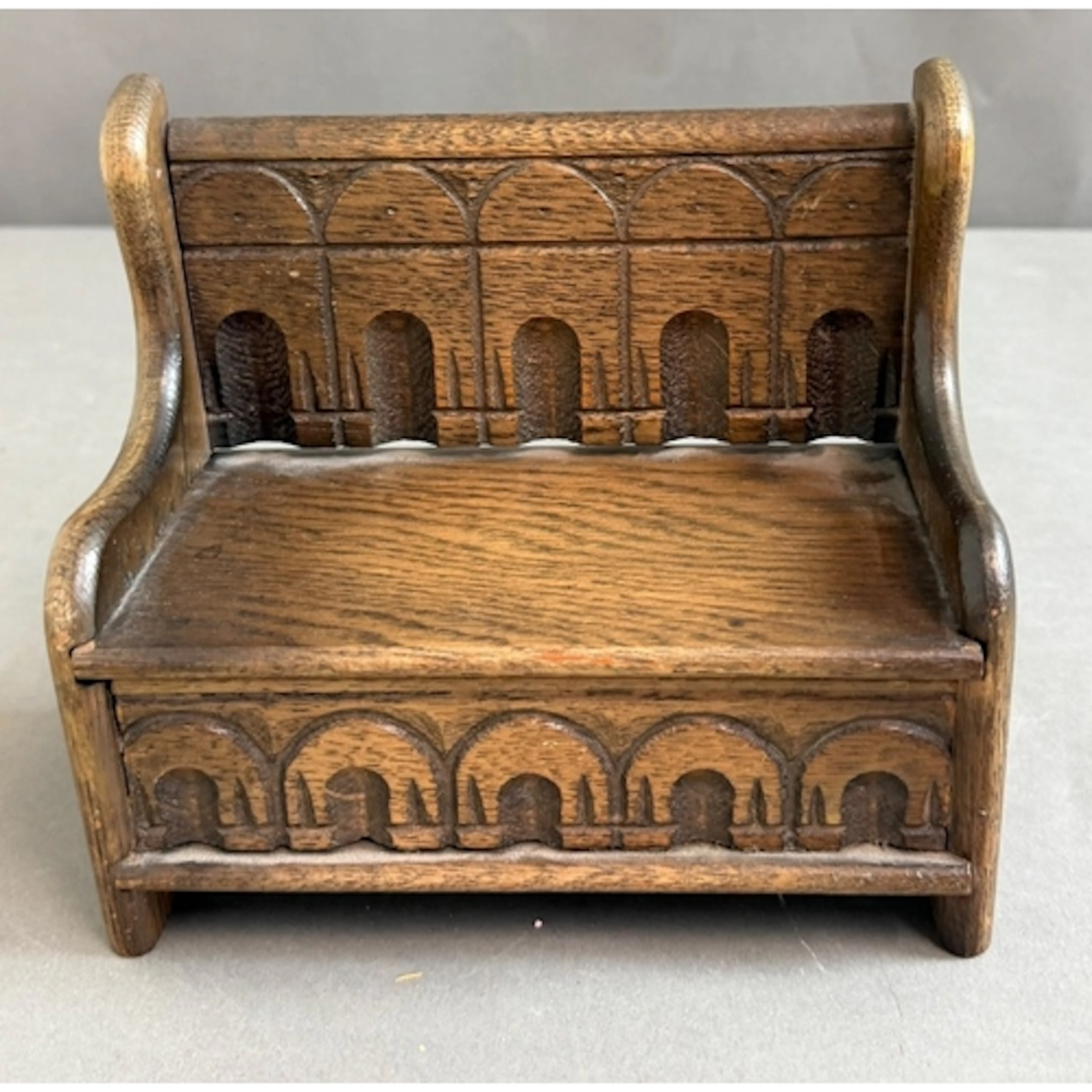 A miniature Tudor style box seat or monks bench with music b...