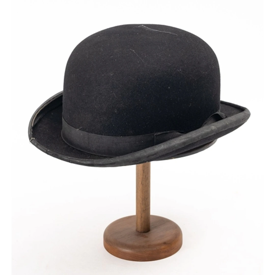 An early 20th Century West & Co black top hat. Having a whit...