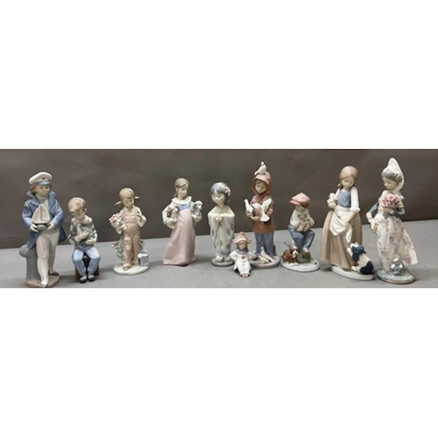 A selection of Lladro and Nao figures. Various subjects and ...