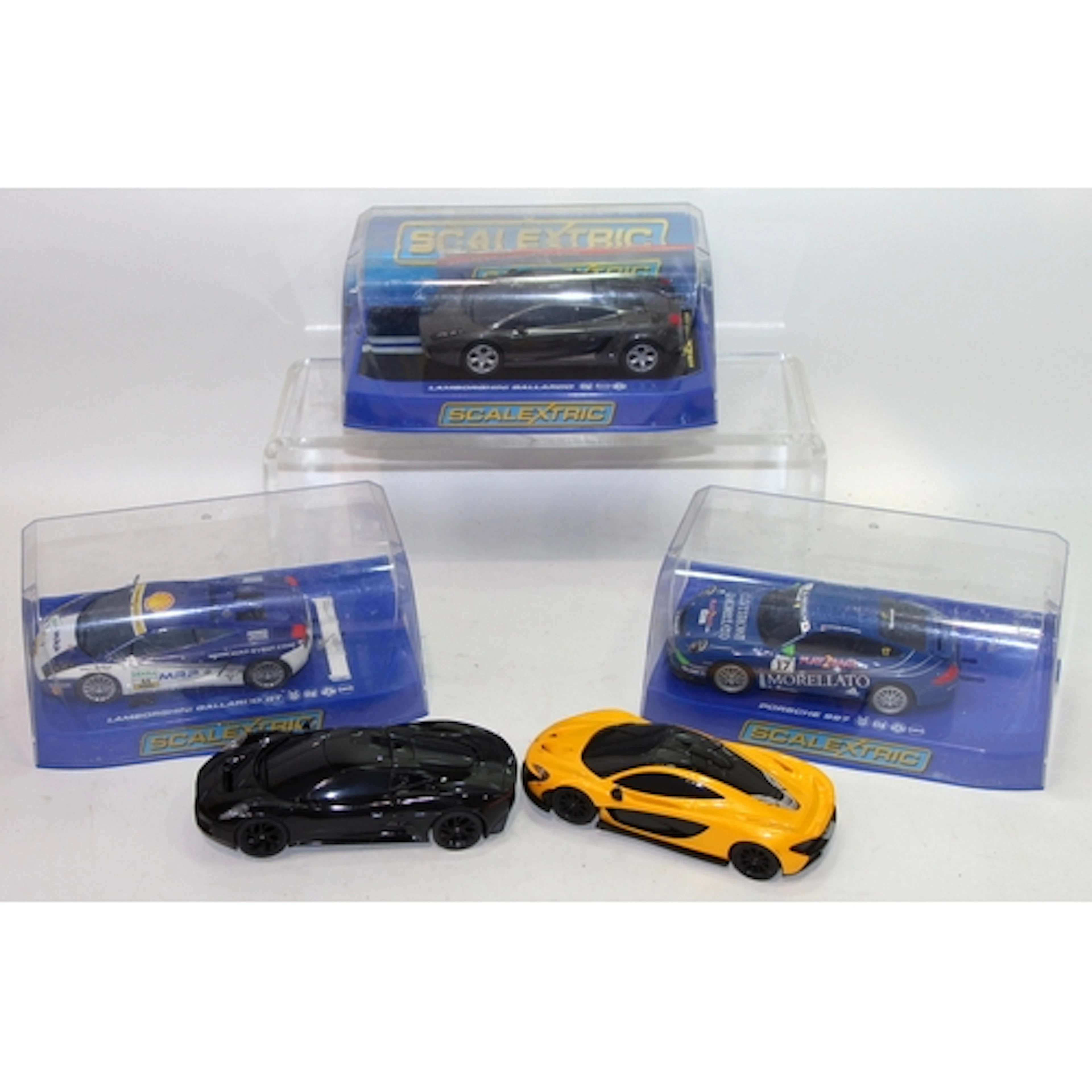 A collection of Scalextric slot car racing vehicles, 5 in lo...