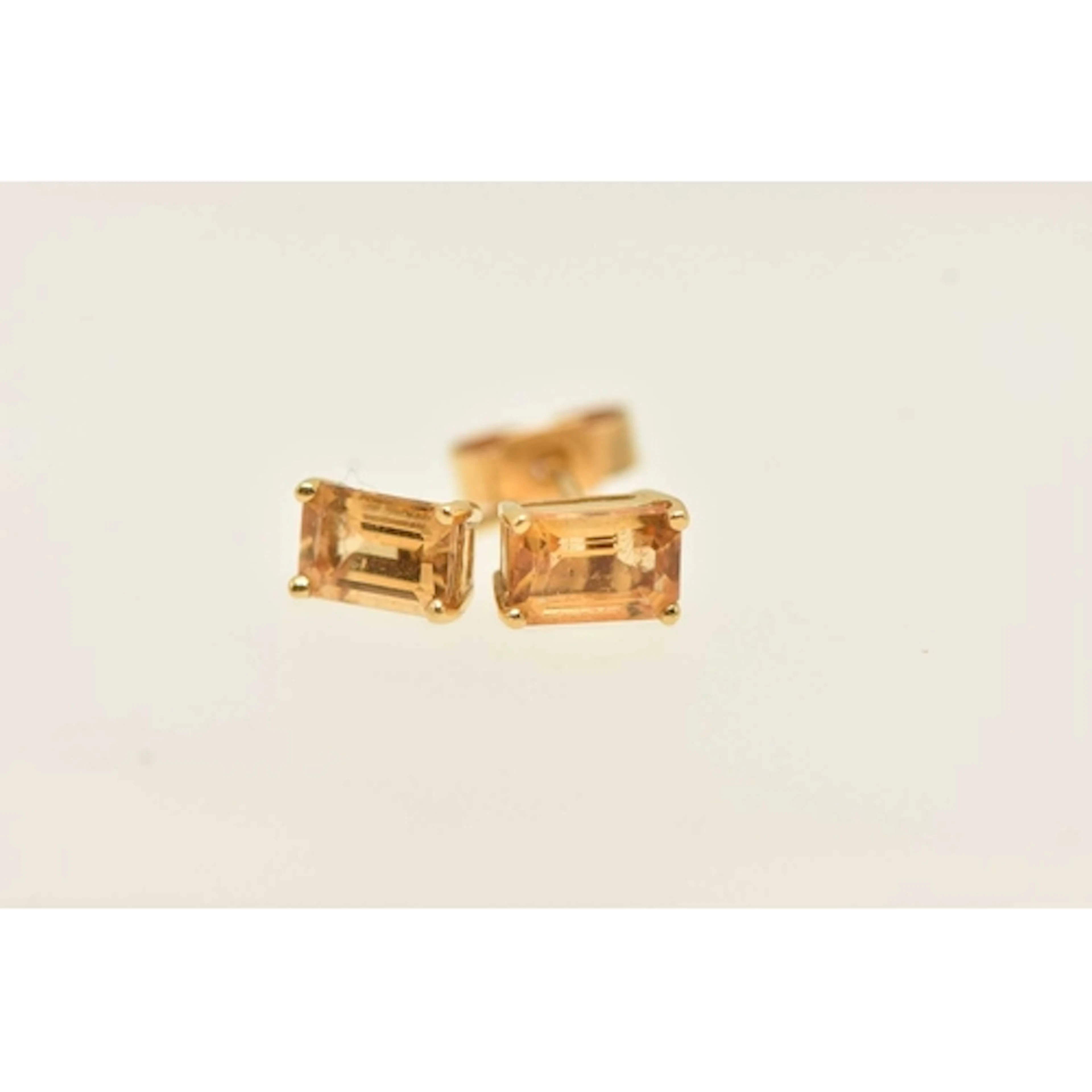 A PAIR OF YELLOW METAL GEM SET EARRINGS, rectangular cut cit...