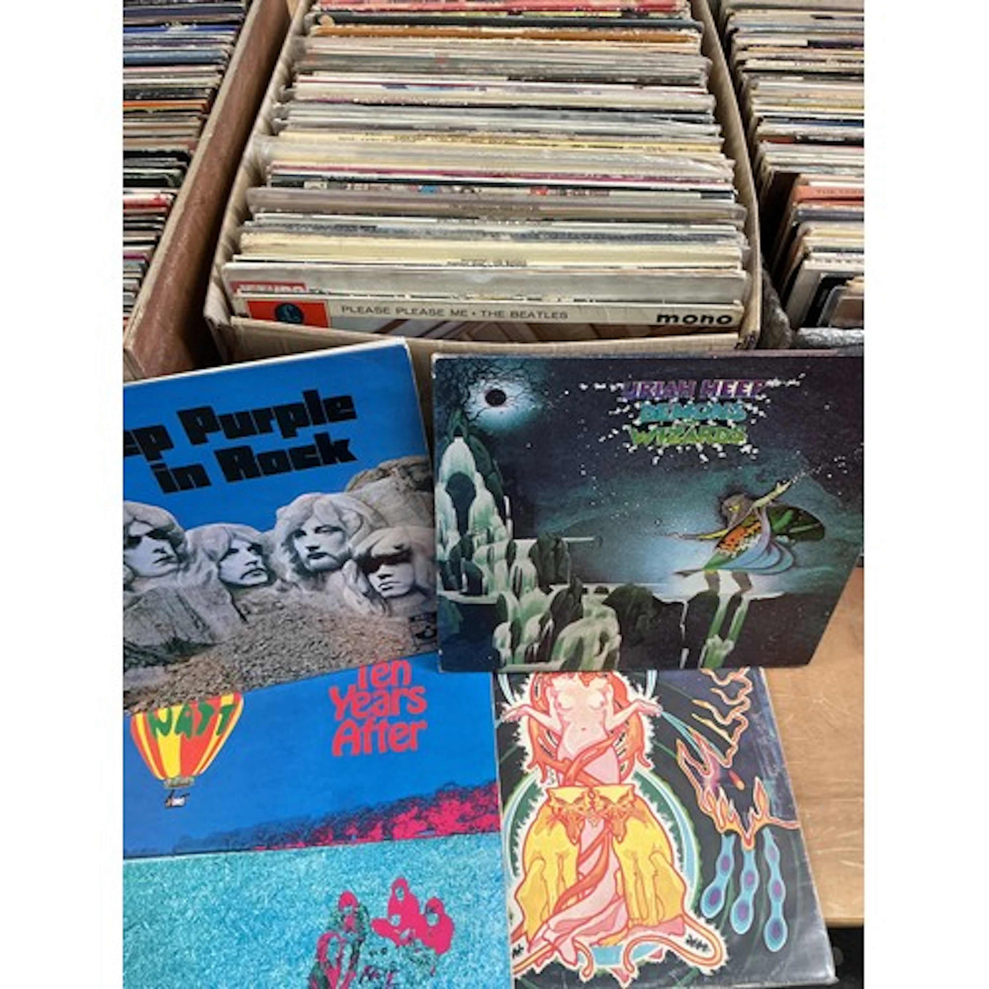 A box of rock and pop LPs by various artists including Queen...