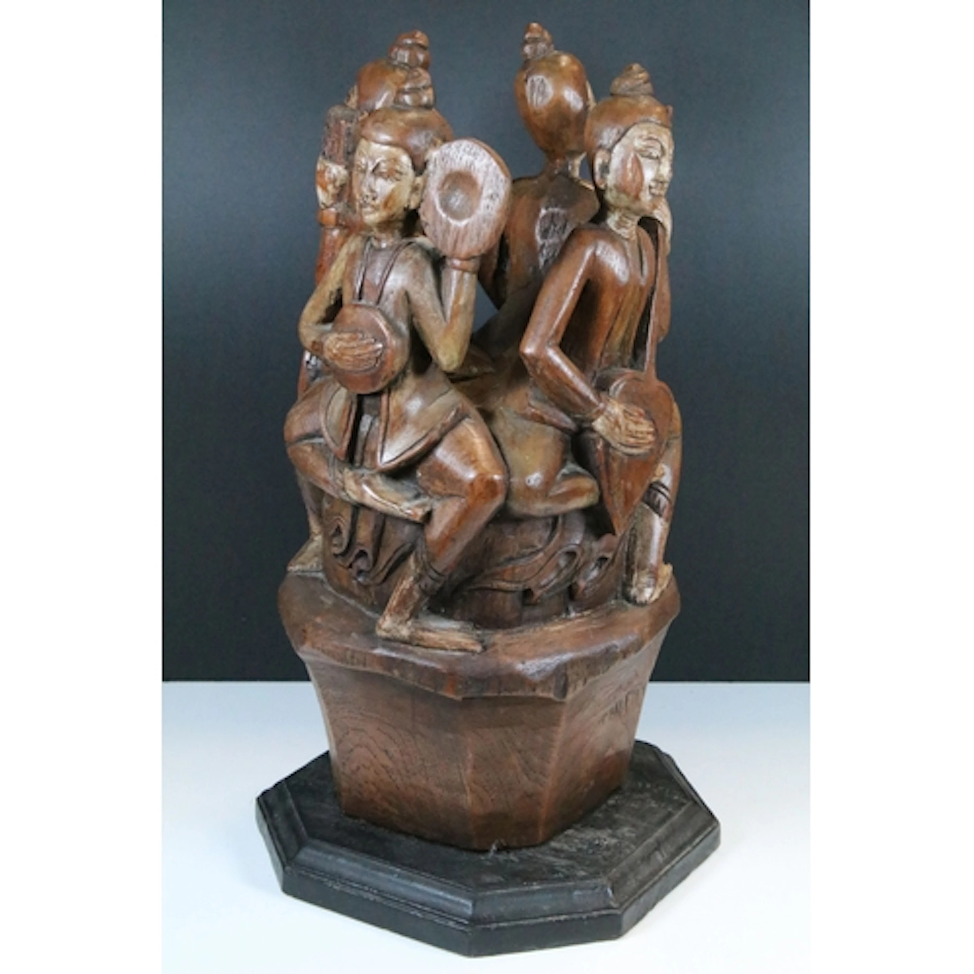 Indonesian carved hardwood figural musical sculpture, compri...