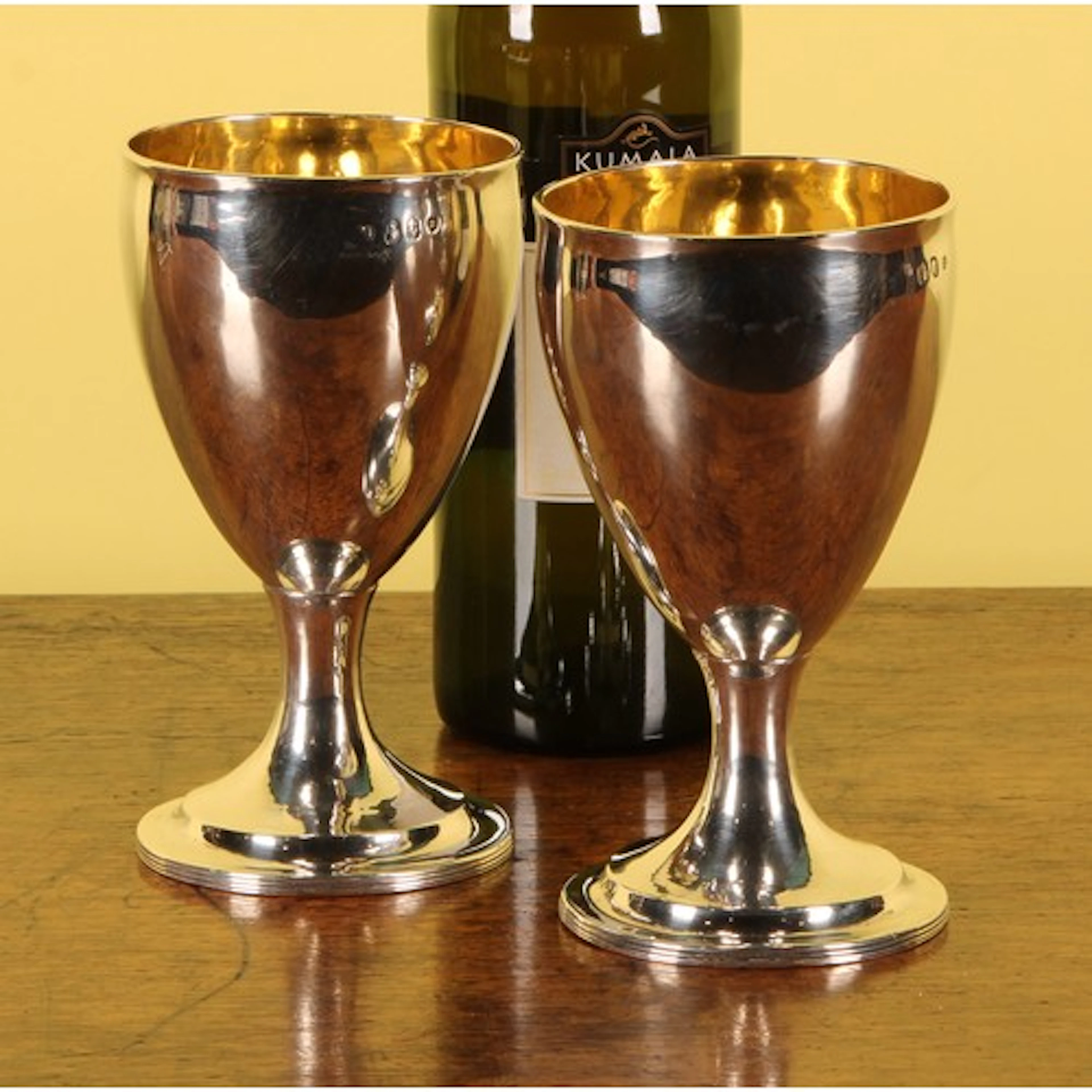 A pair of George III Irish silver pedestal goblets, quite pl...