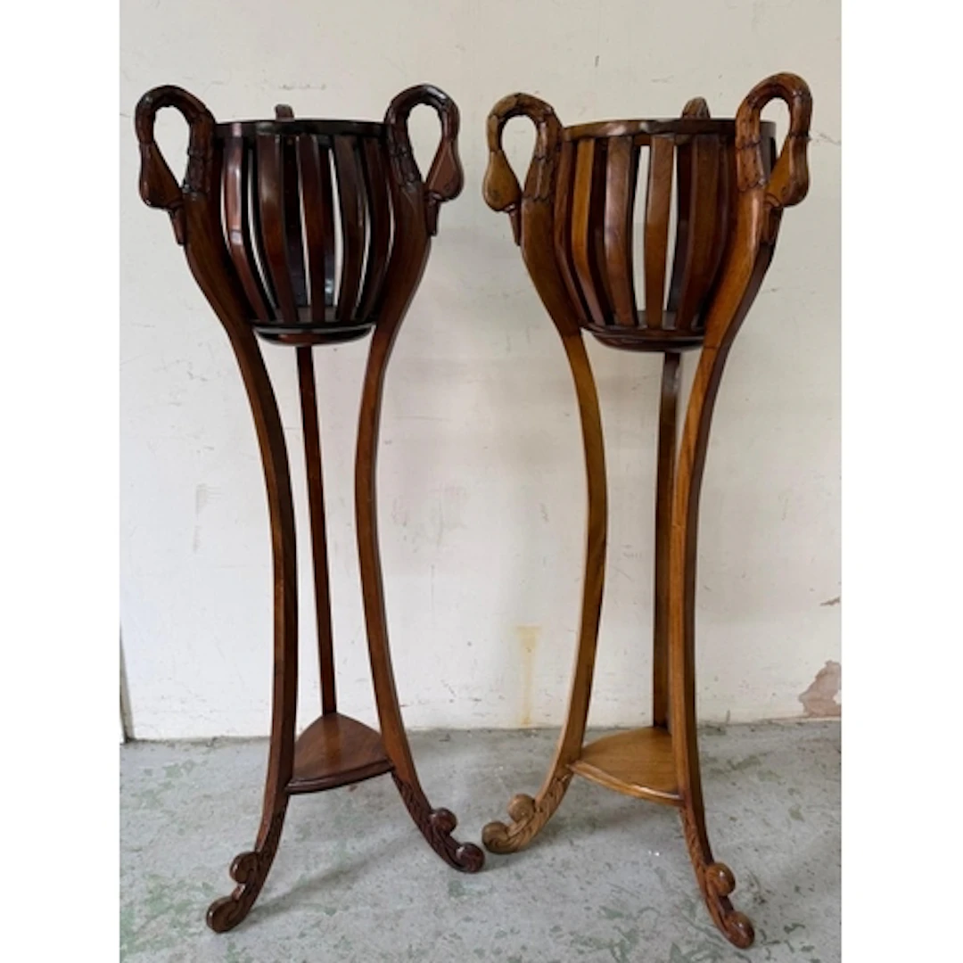 A pair of mahogany carved swan neck plant stands. Height 131...