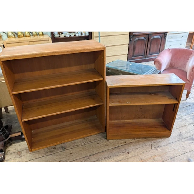 A teak open bookcase together with a small teak shelf unit