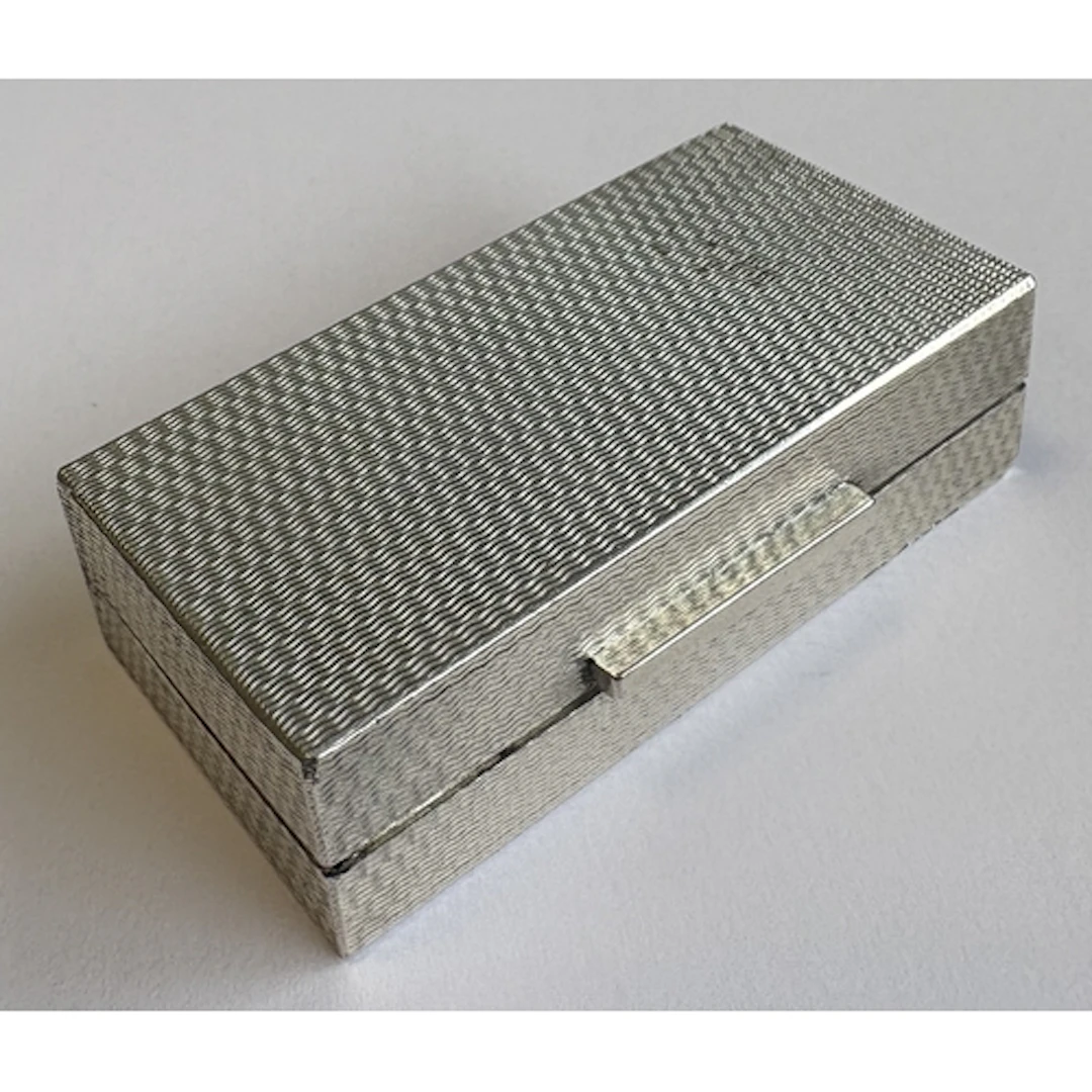 A silver snuff box with engine-turned decoration. Birmingham...