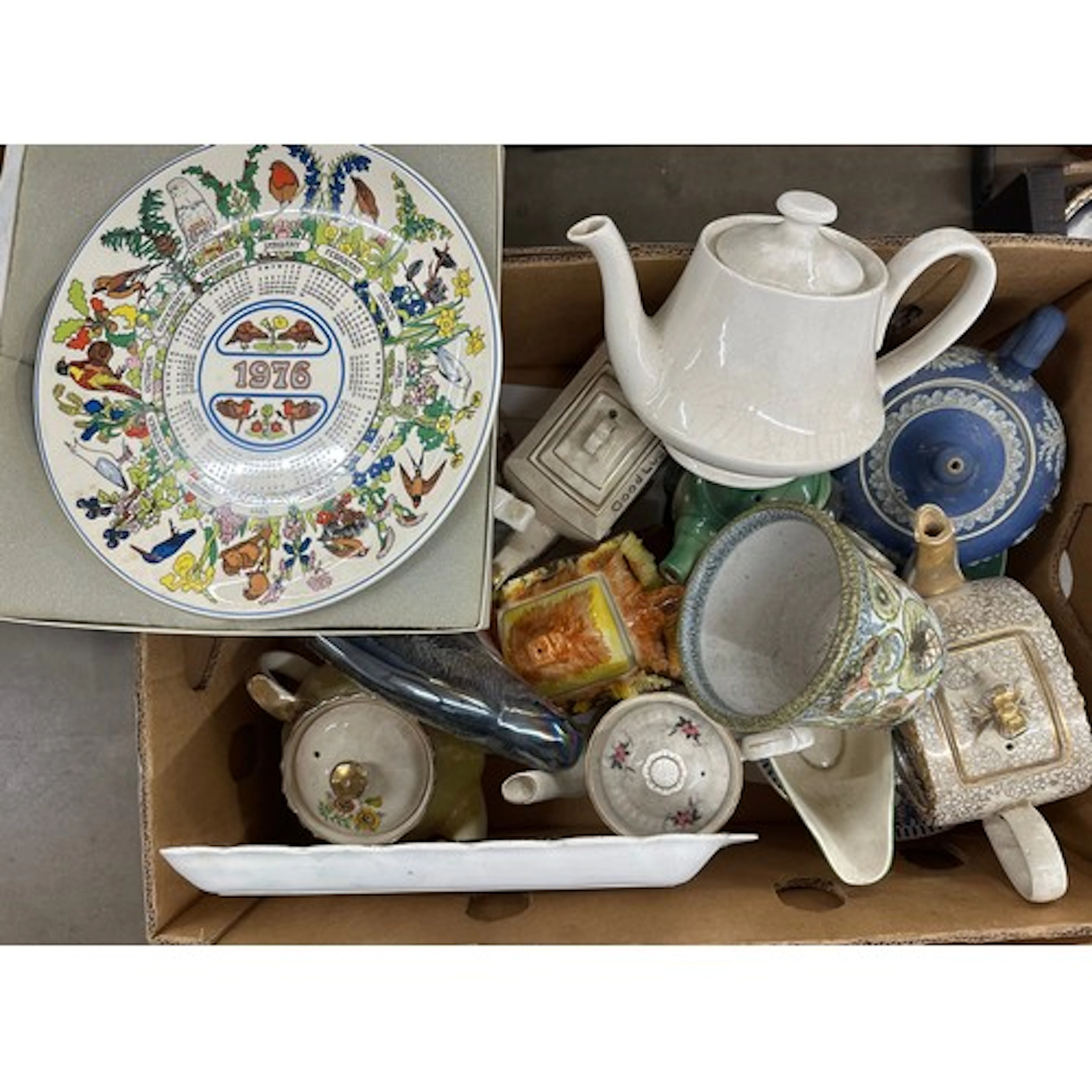 A collection of mixed china and ceramic teapots to include n...