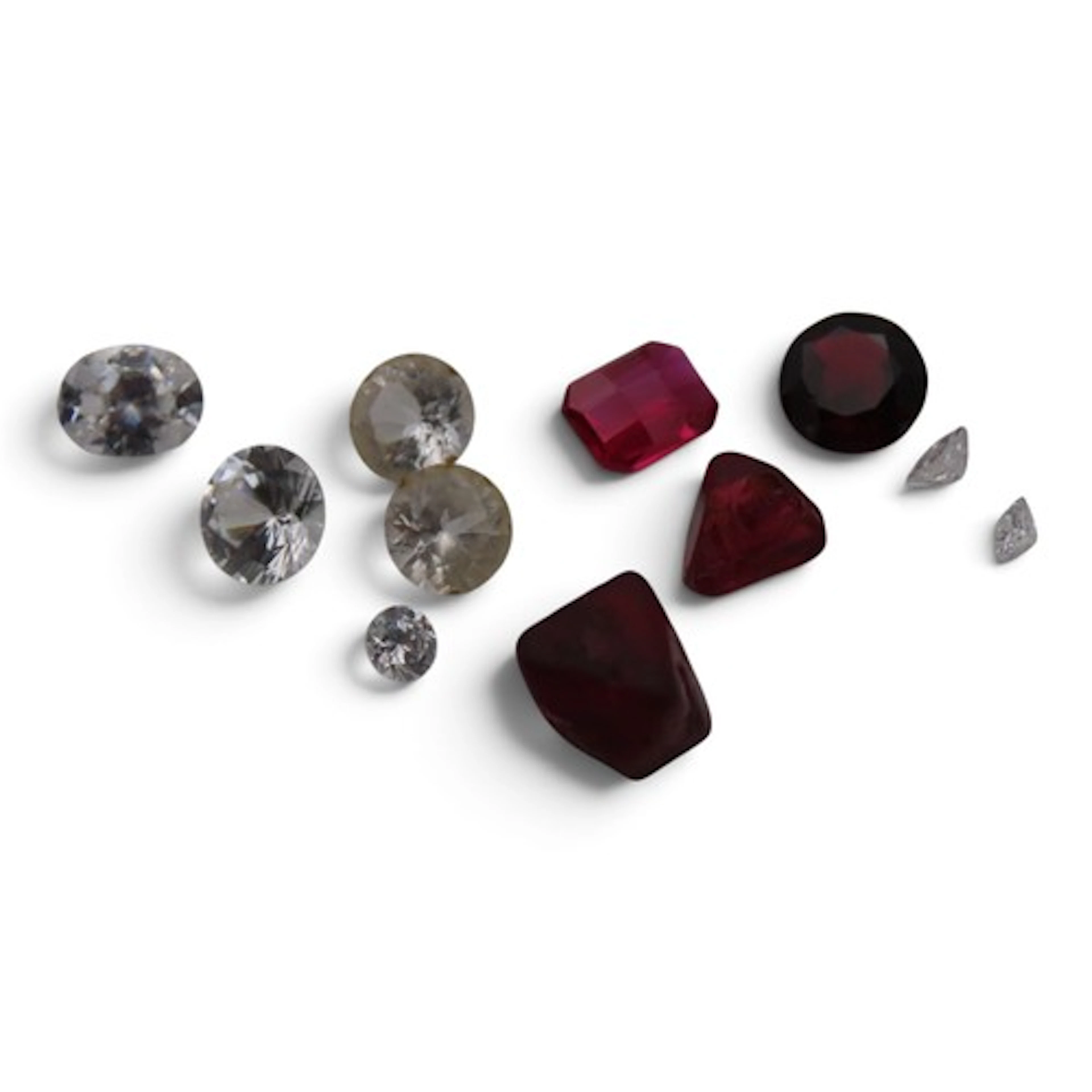 A collection of unmounted gemstones, to include a princess-c...