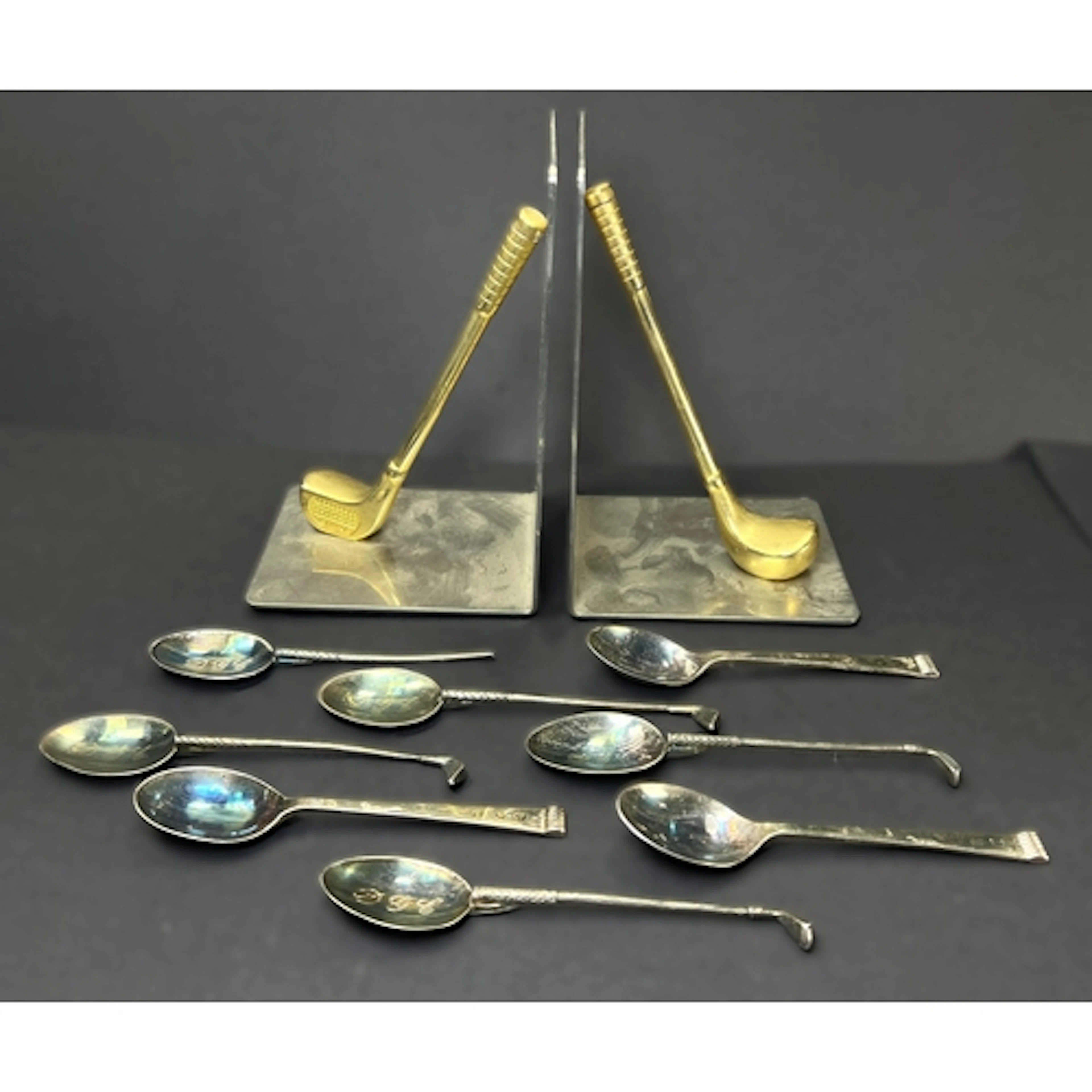 A selection of golfing memorabilia inc. a pair of metal golf...