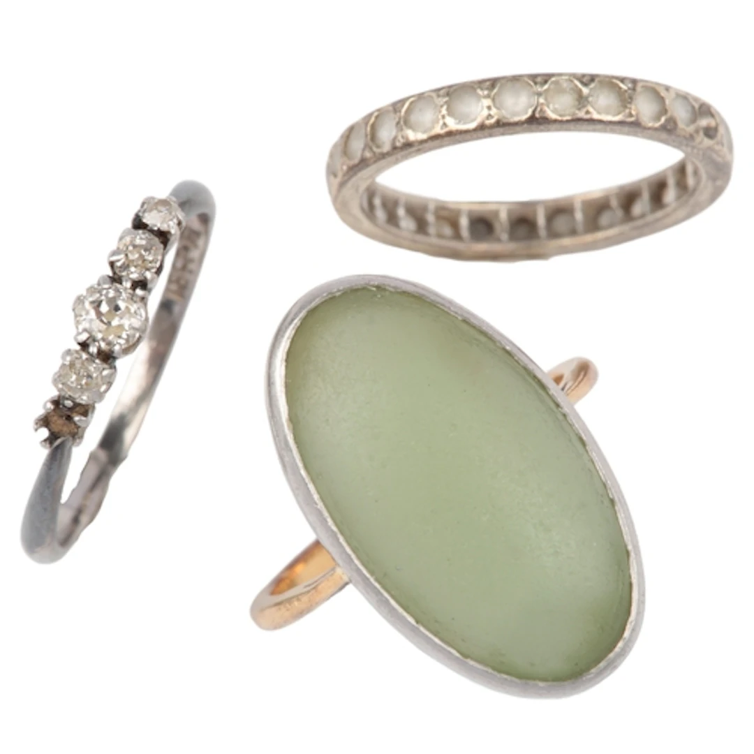 A collection of jewels, comprising: a ring set with circular...